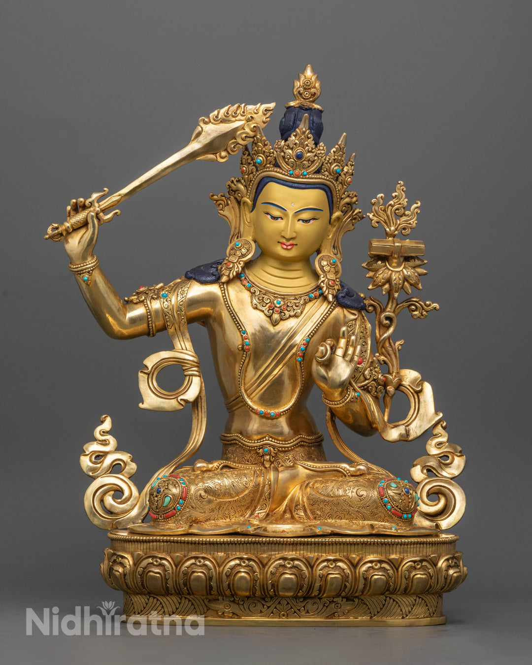 Handcrafted 24k gold gilded Manjushri Buddha Statue sitting on a lotus throne, symbolizing wisdom and enlightenment, with intricate detailing.