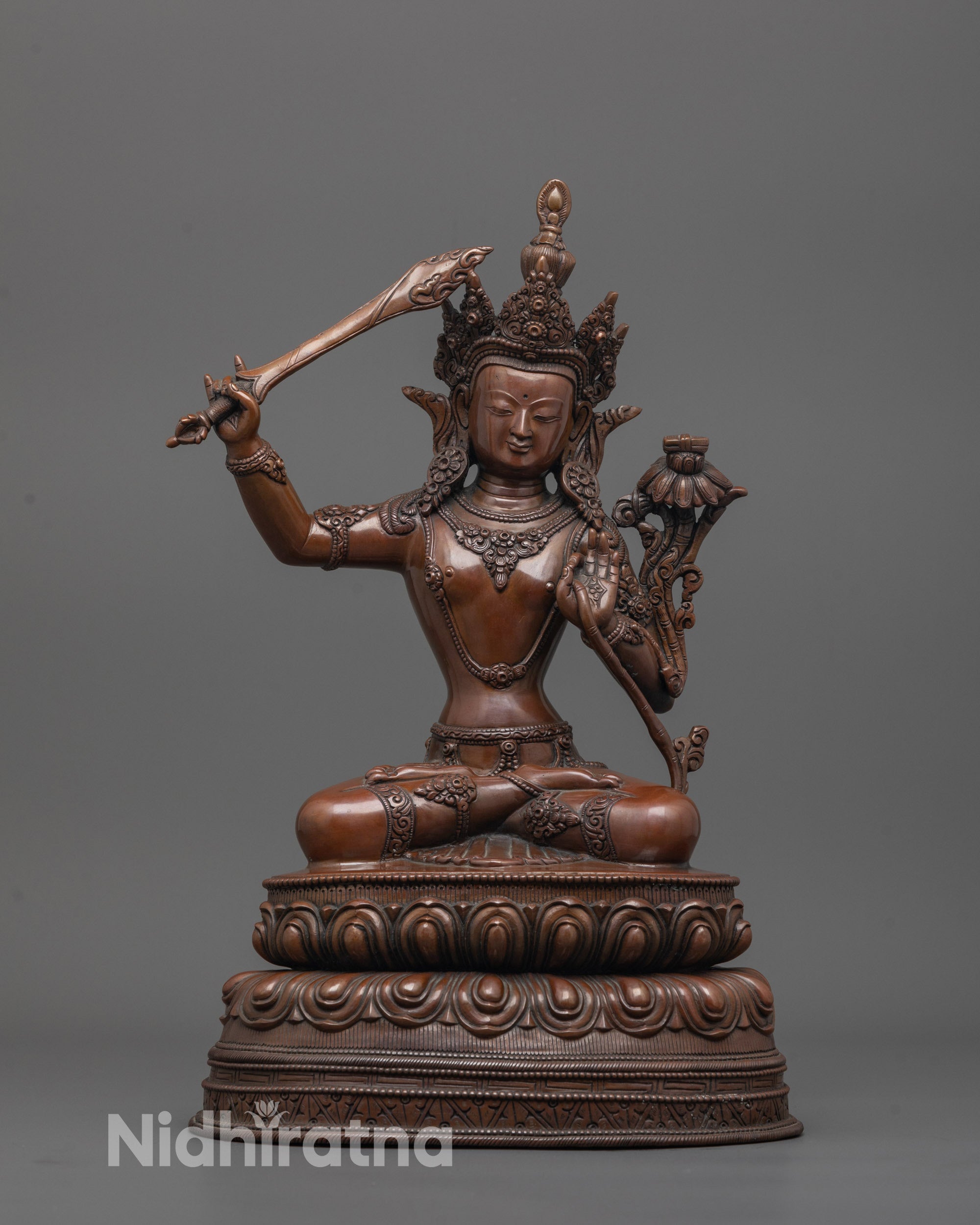 Oxidized Manjushri Statue front view showing lotus base and wisdom sword