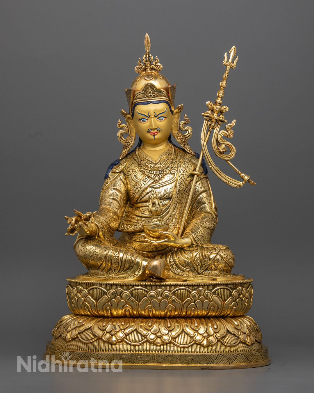 Guru Rinpoche Padmasambhava statue | Tibetan Buddhist figure | lotus-born master, Vajrayana guru, tantric meditation teacher, holding vajra and kapala, seated on lotus throne, rich traditional attire, Himalayan Buddhist icon.