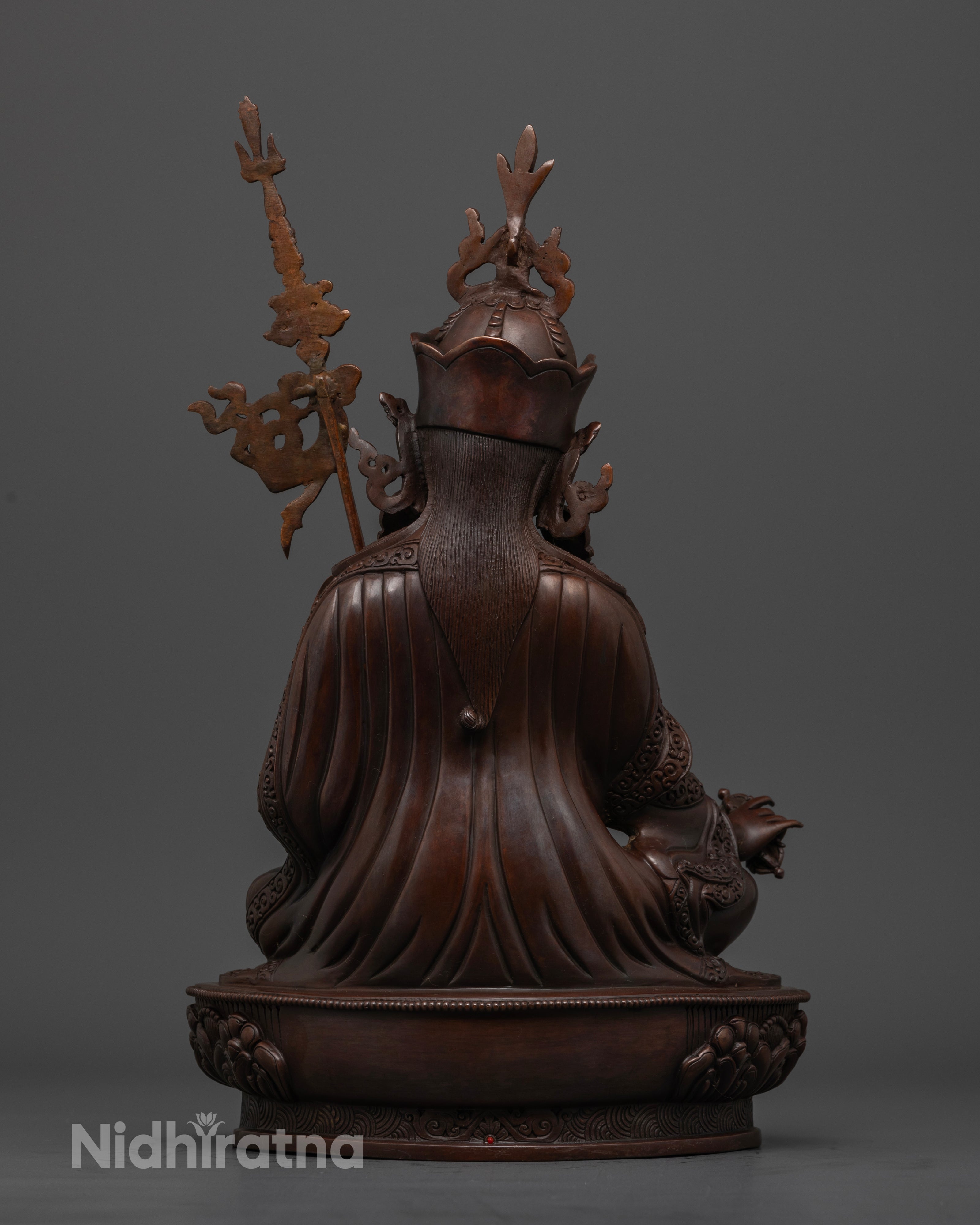 The backside of oxidized Guru Rinpoche statue
