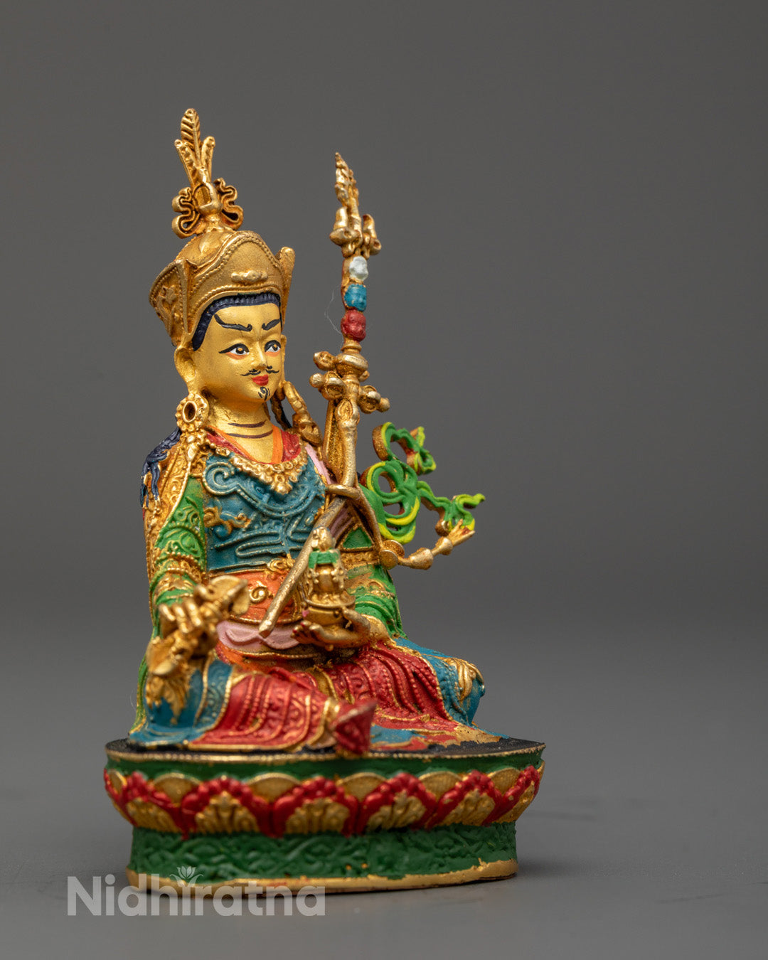 Padmasambhava statue holding Feng Shui Golden Trident and vajra – symbolic Tibetan spiritual decor for inner peace