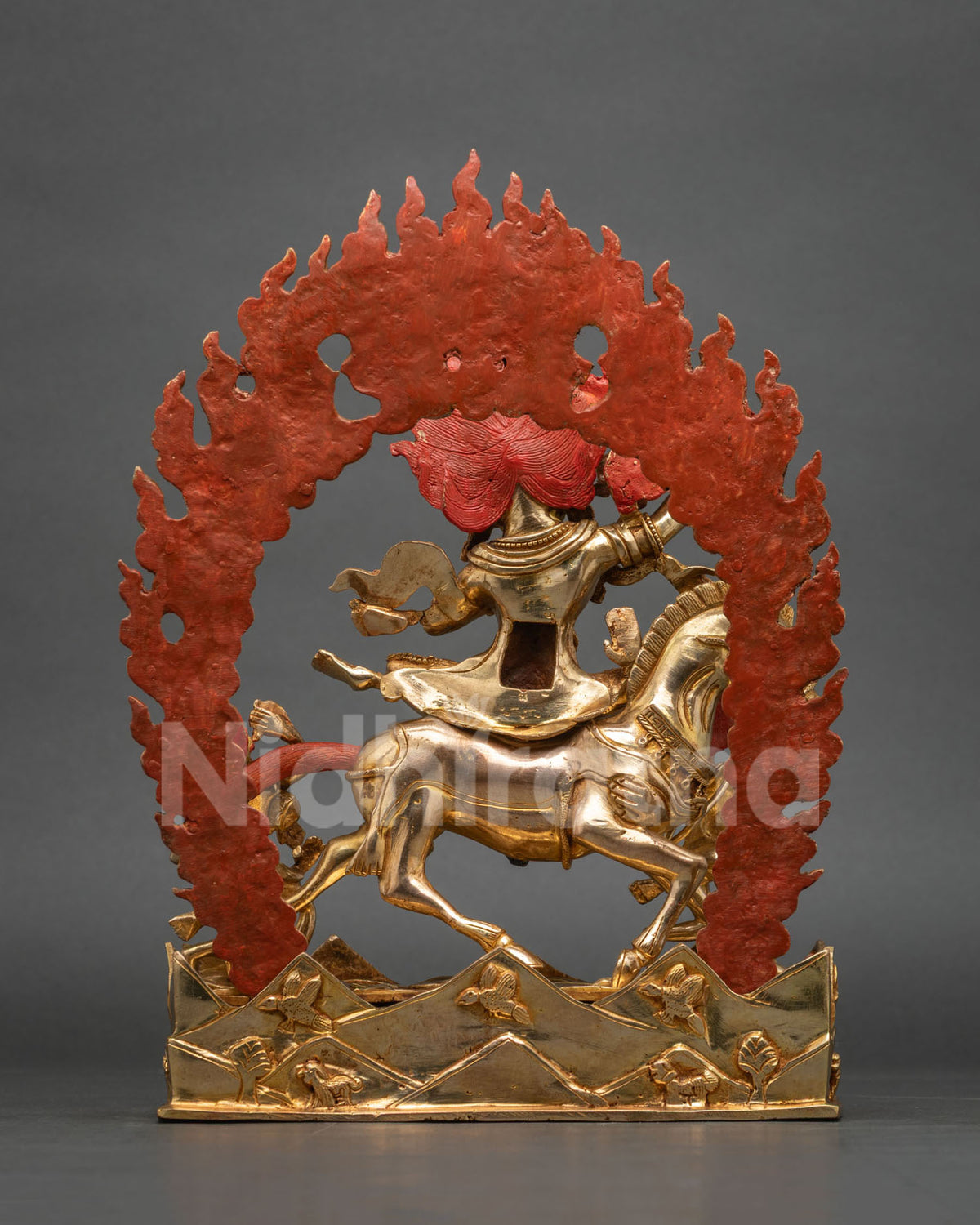 Back view of Palden Lhamo statue with red flaming halo and gold-plated mule