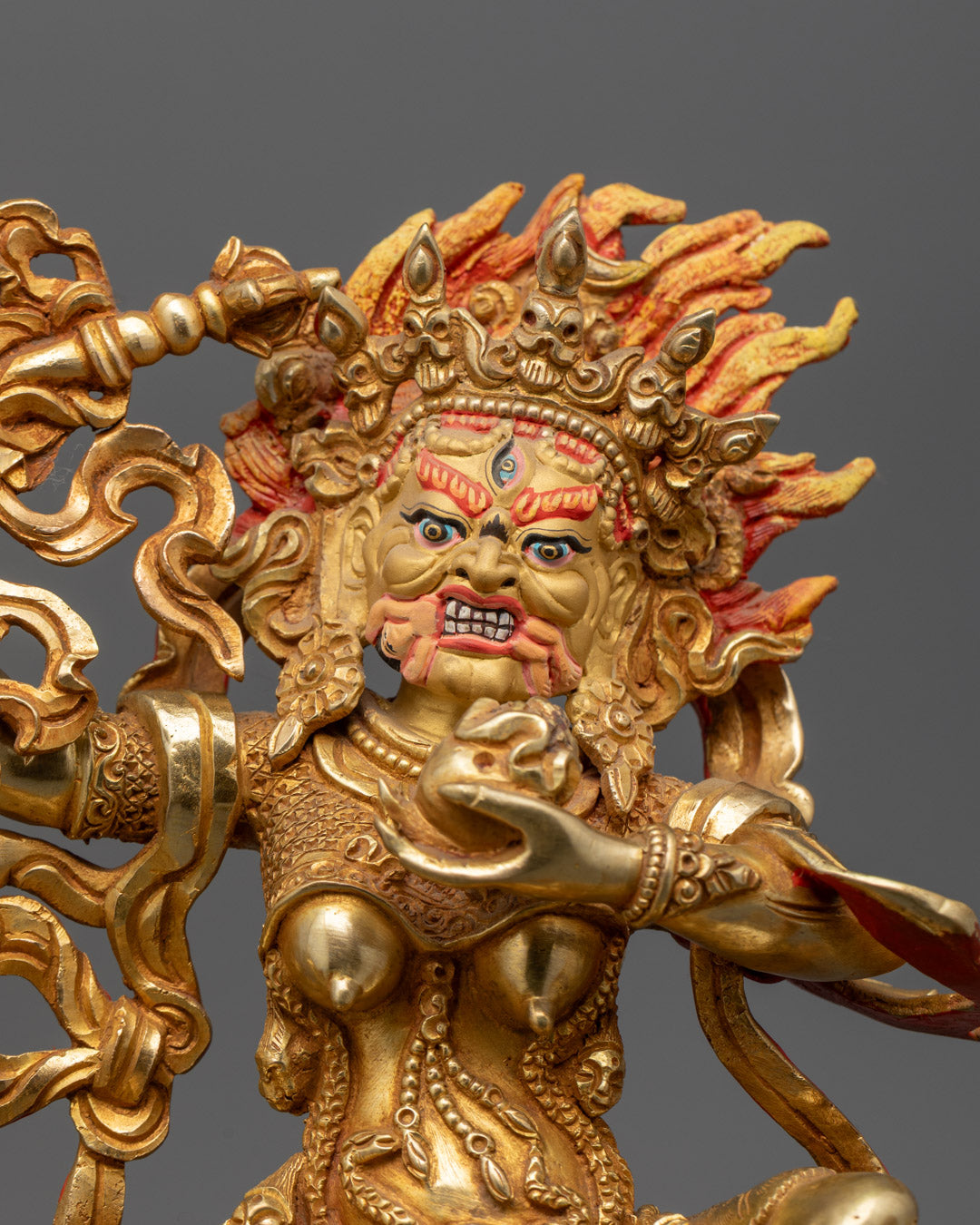 Palden Lhamo statue’s intricate crown and traditional Tibetan jewelry carvings.