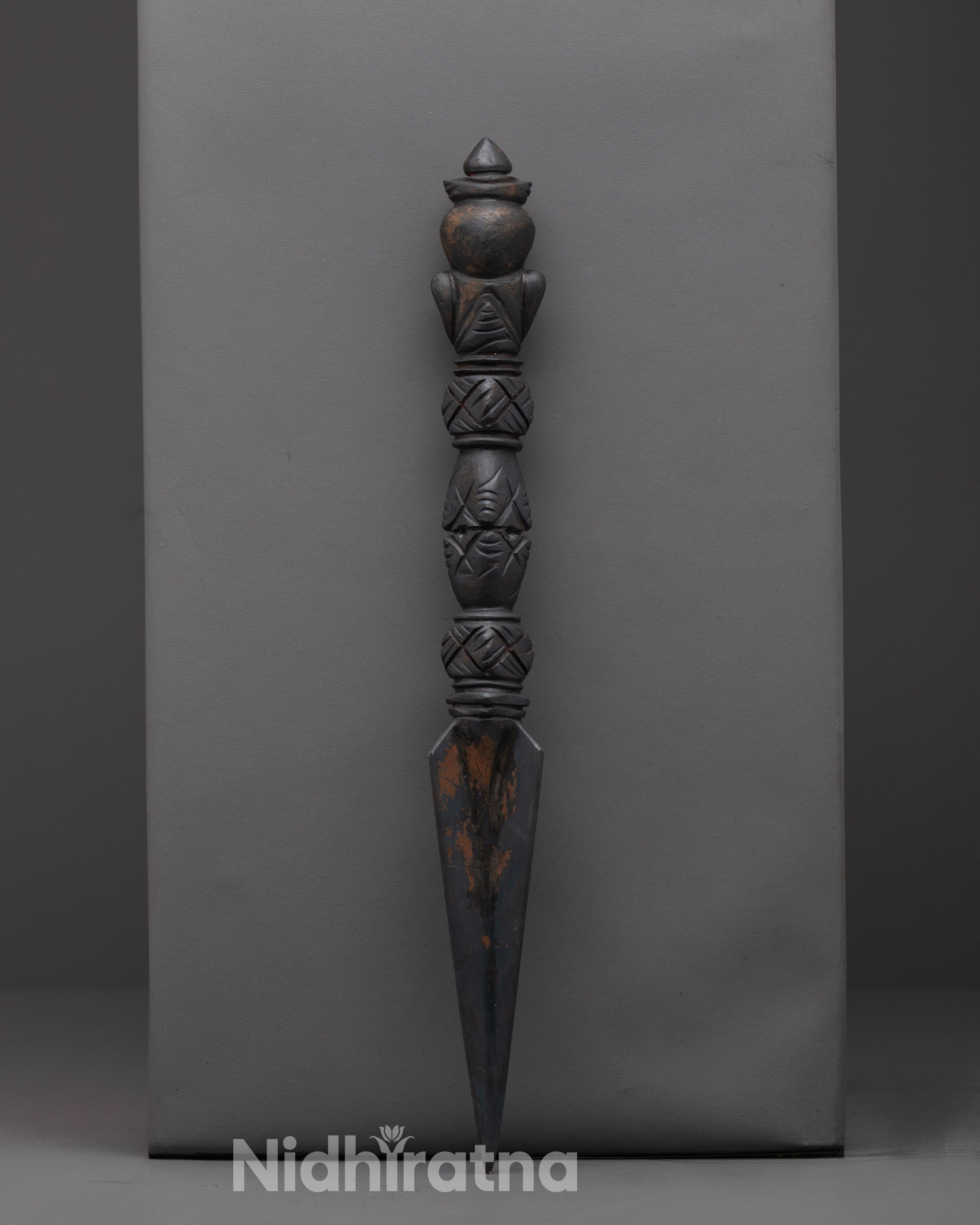 Phurba dagger placed on altar for meditation and spiritual transformation