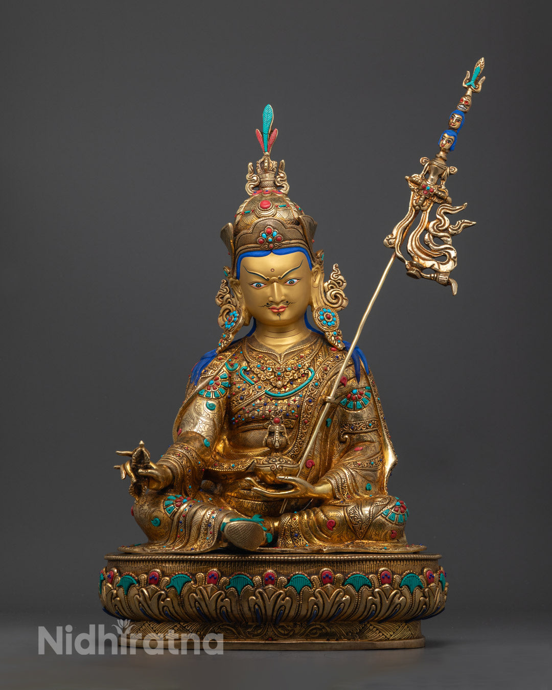 Premium Guru Rinpoche Statue with 24k gold-gilded face and intricate carvings, handcrafted by Nepalese artisans.