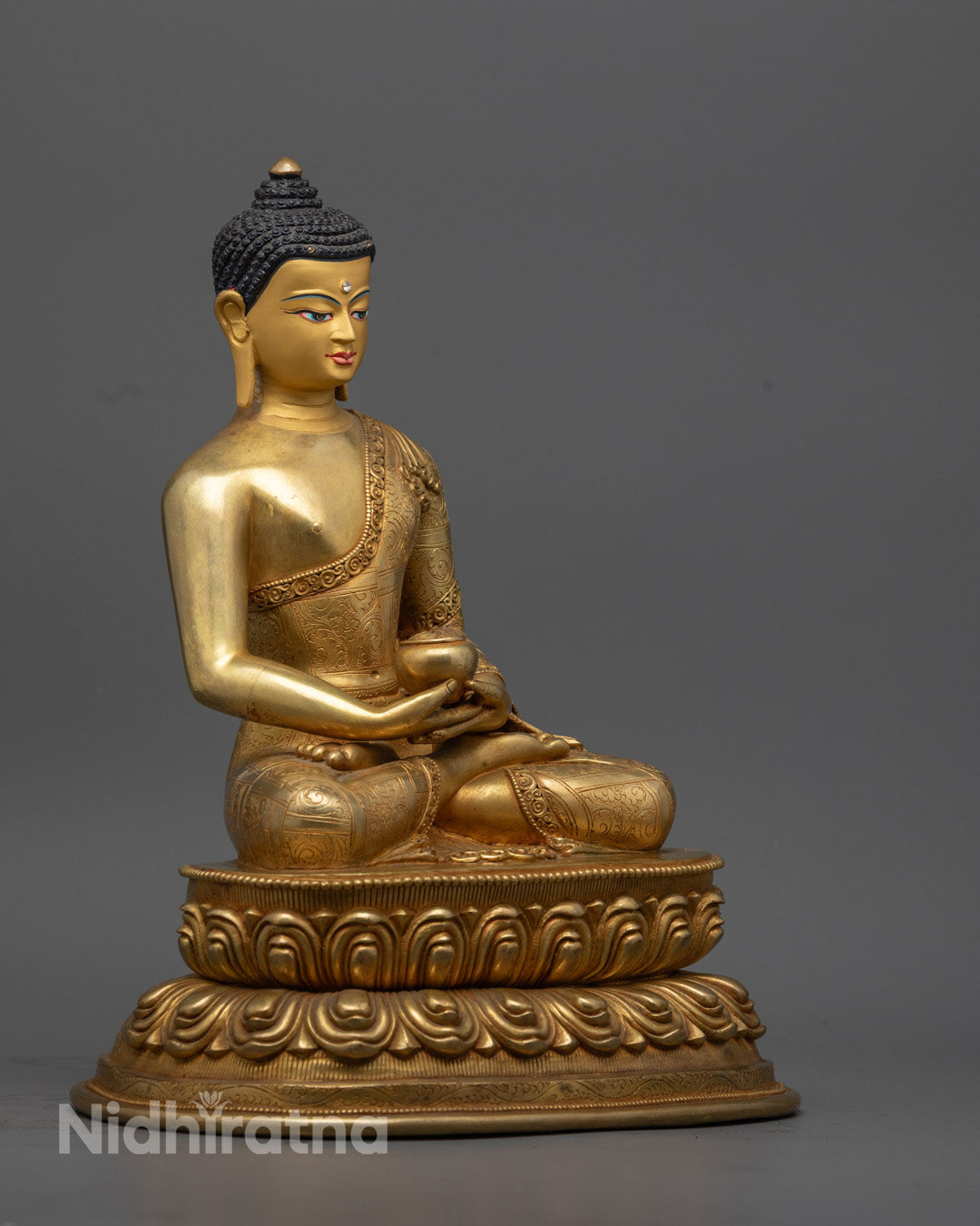 Profile view of Amitabha Buddha statue in Dhyana mudra meditation posture, seated on intricately carved lotus throne with gold leaf details