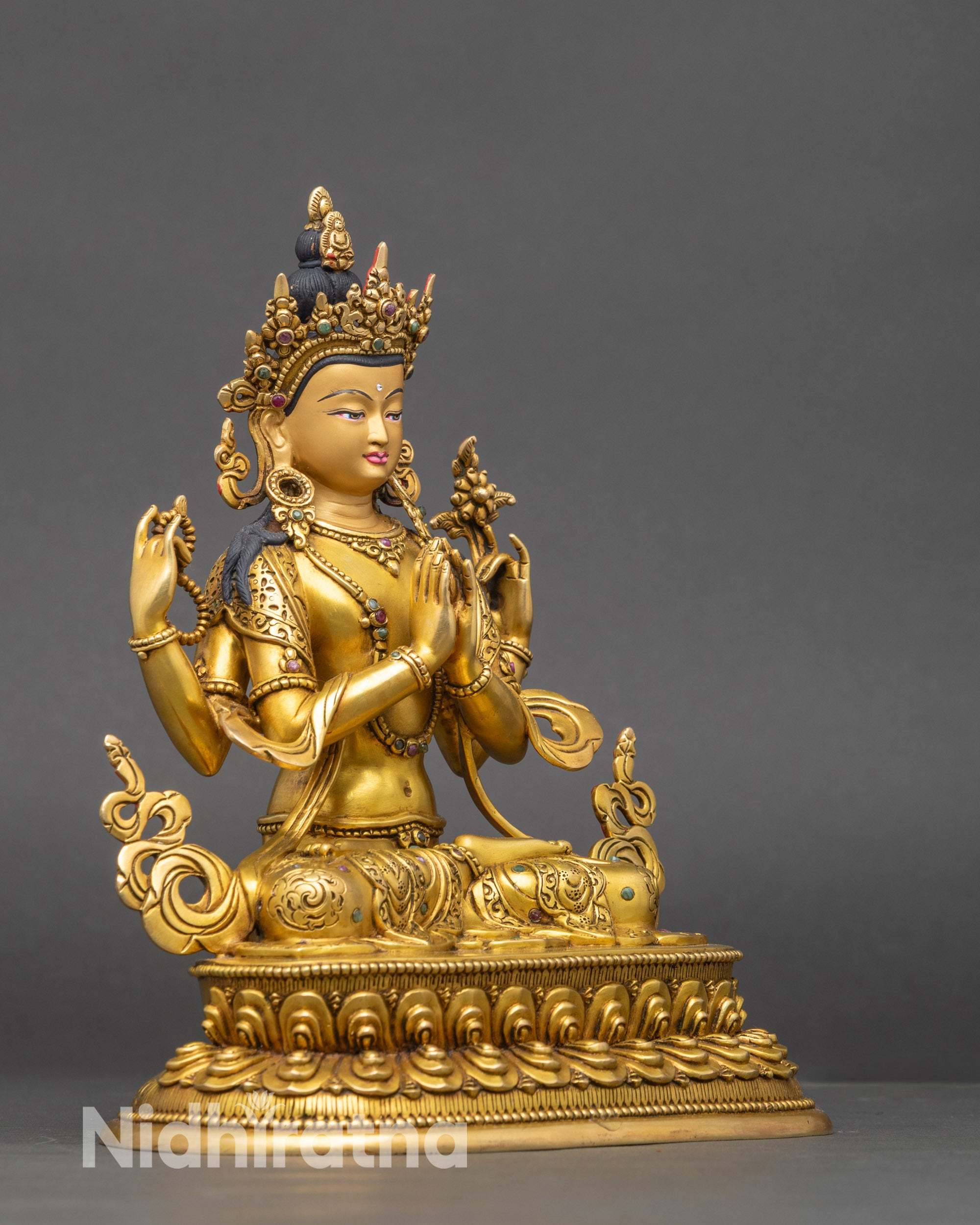 Profile view of Four-Armed Chenrezig statue, copper and 24K gold Buddhist sculpture