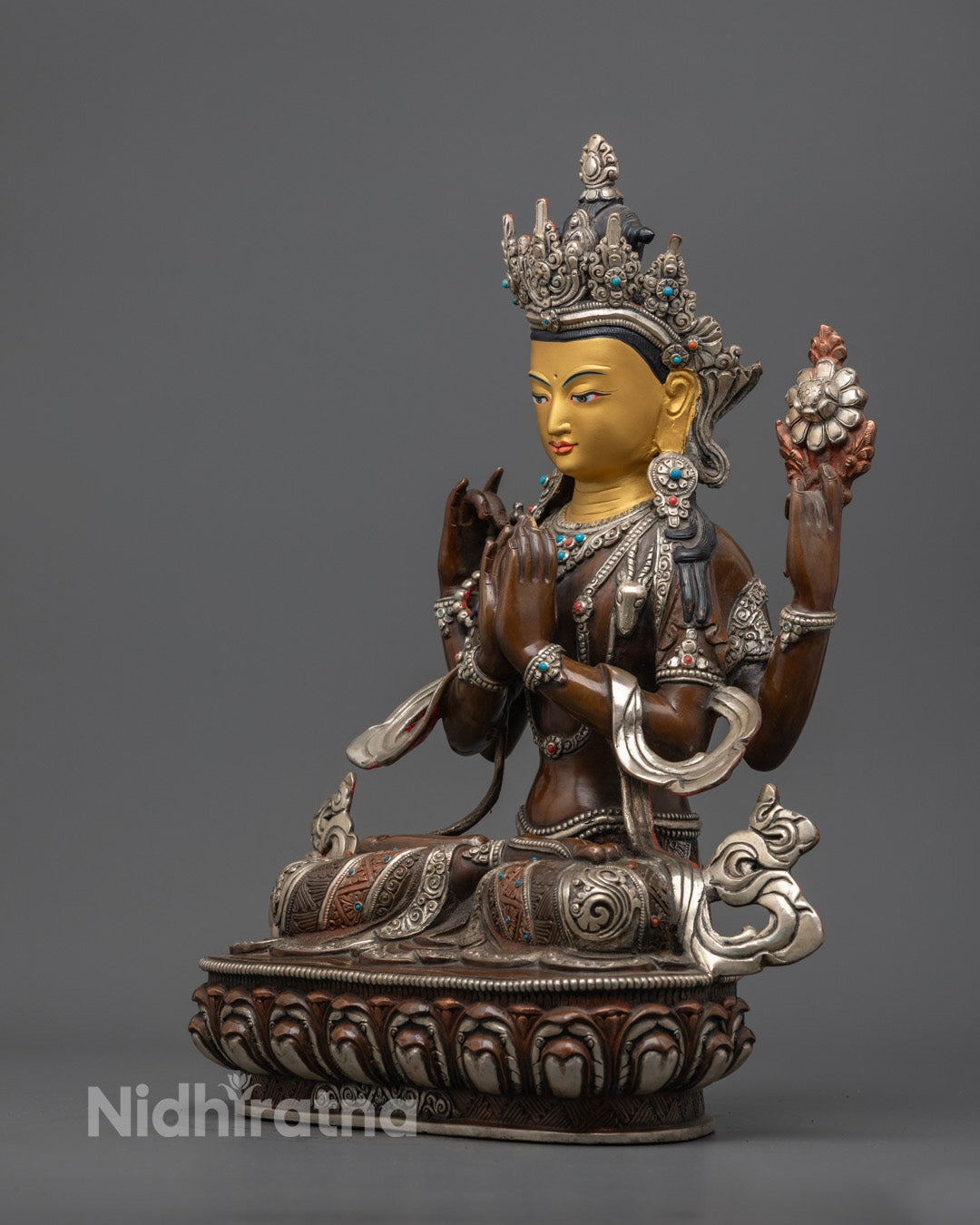 oxidized copper Chenrezig statue showing intricate hand-carved details, sacred mudra position, and hollow chamber for mantra filling