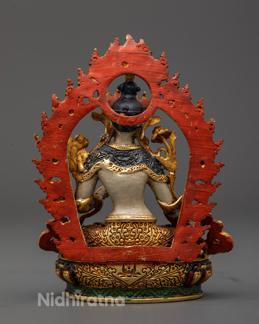 Radiant halo surrounding machine-made White Tara statue representing healing, longevity, and inner peace