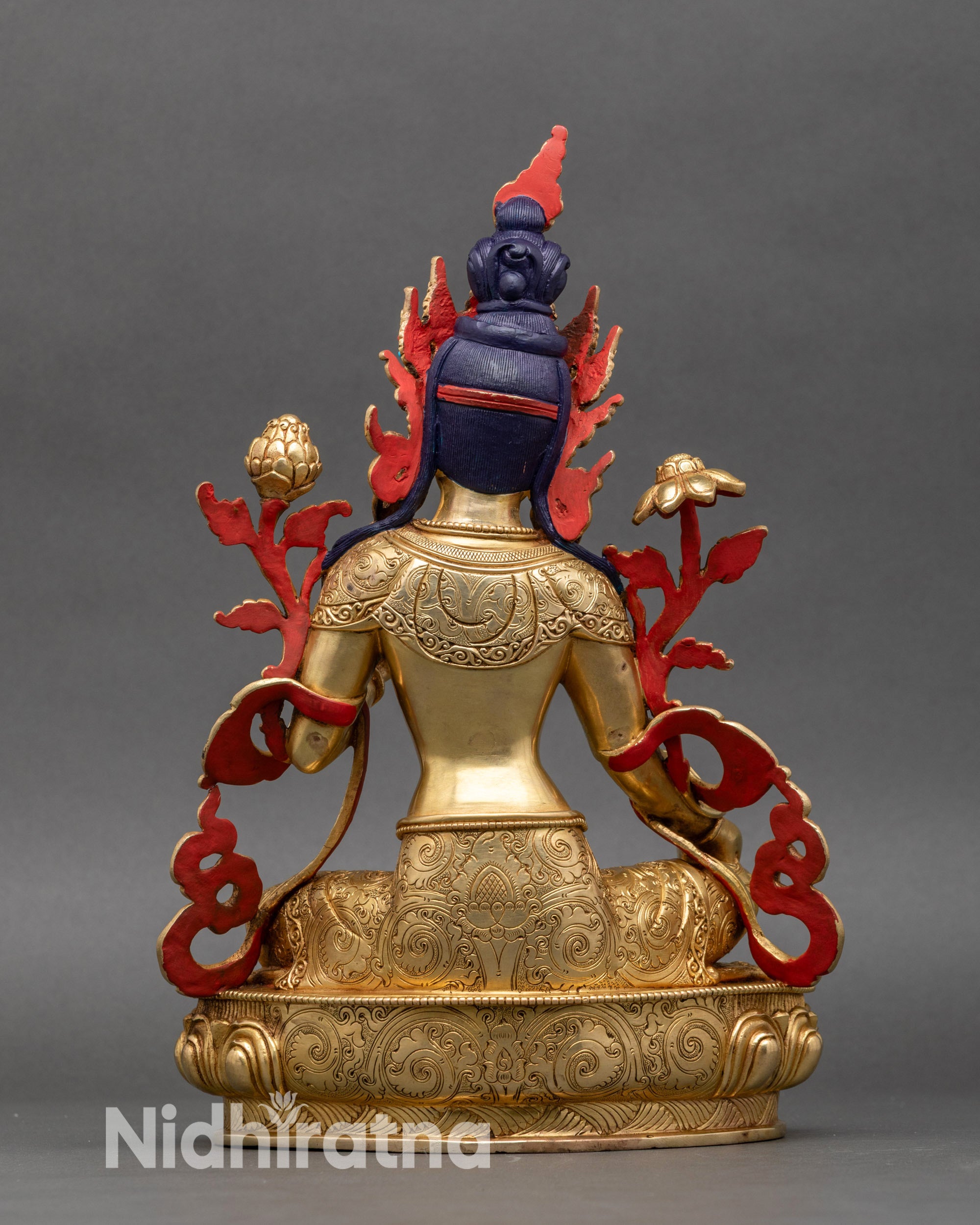 Rear view of Green Tara handcrafted statue showing back ornaments, lotus pedestal base, and gold finish