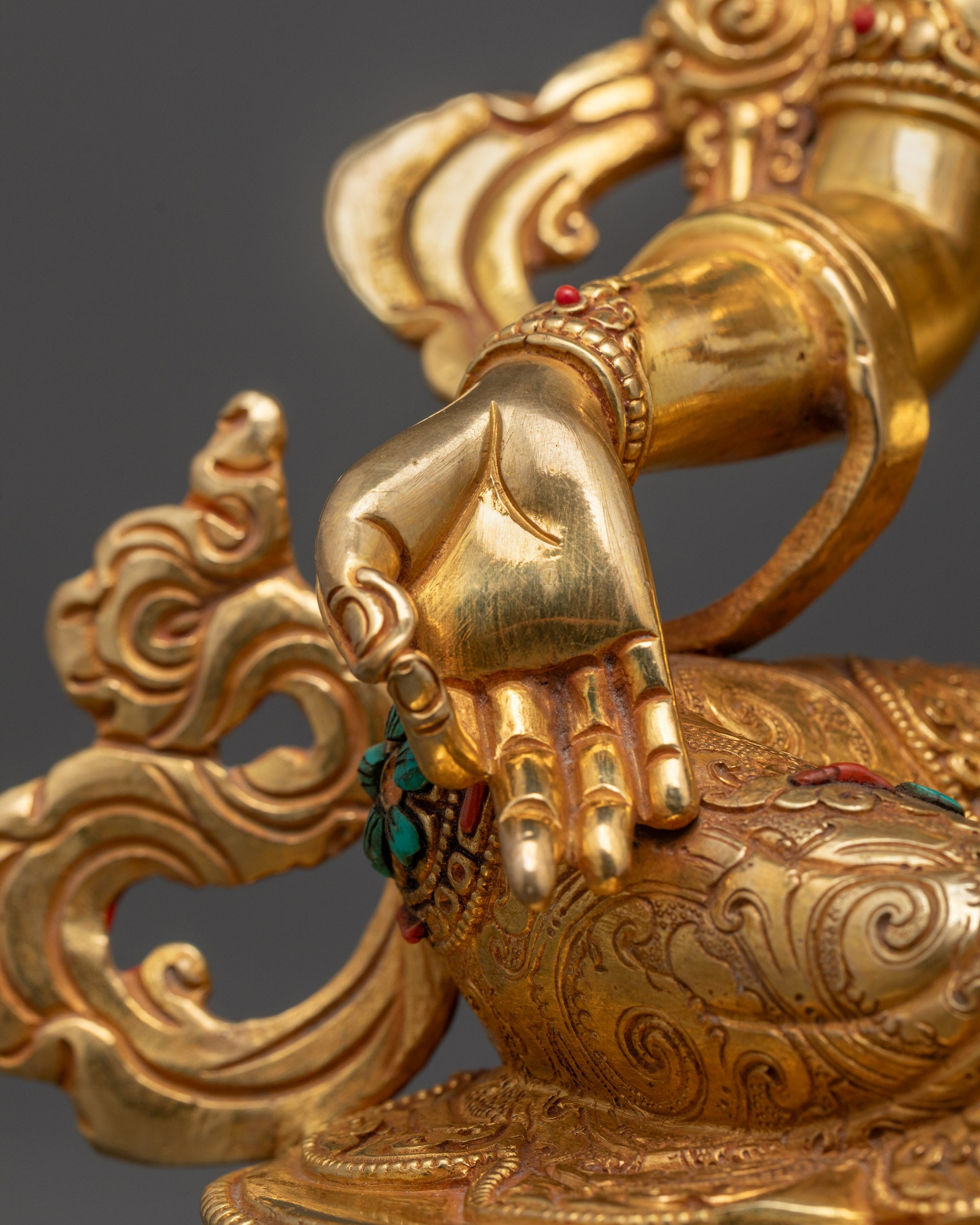 Rear view of Green Tara statue highlighting lotus seat, gold fire gilding on copper base