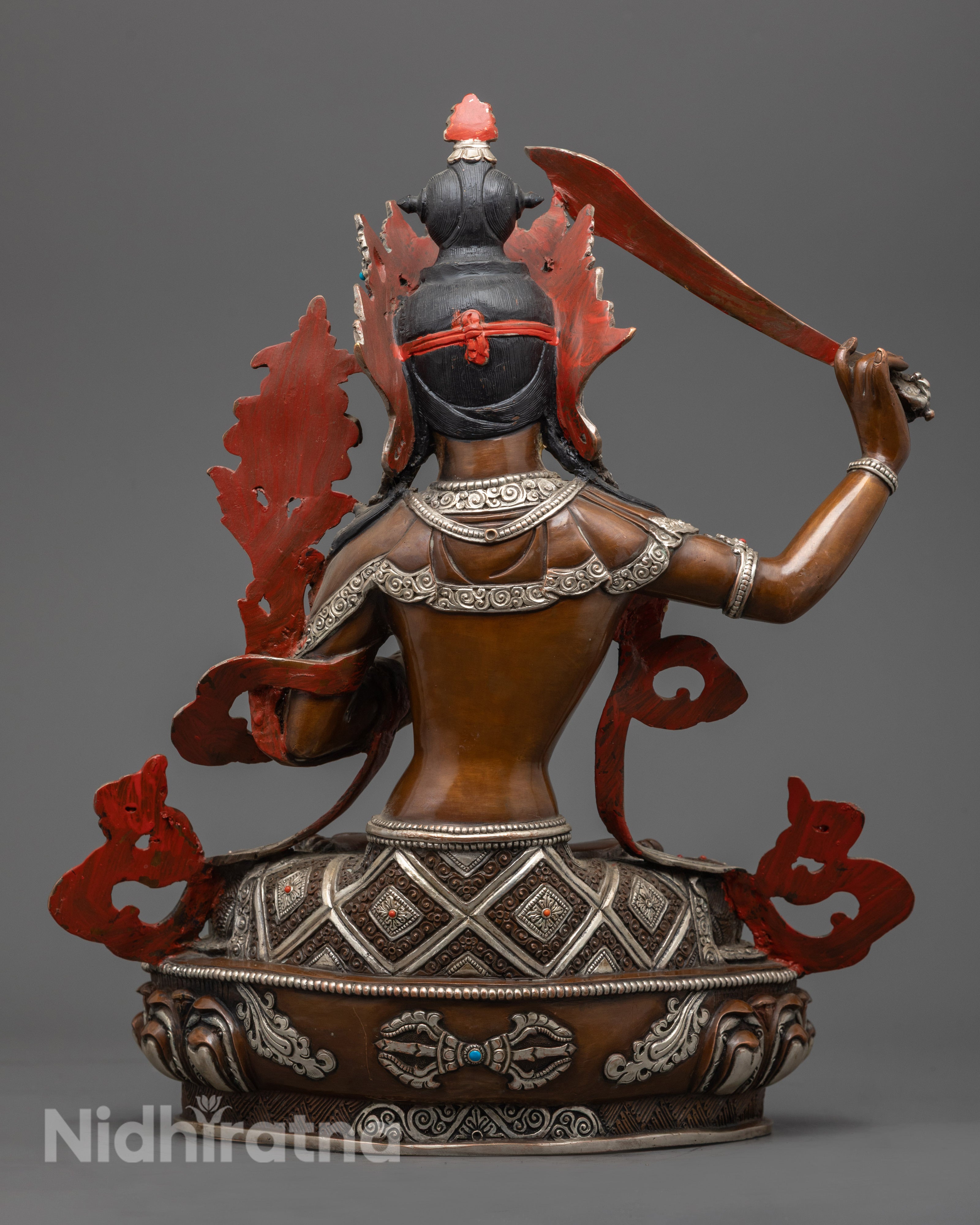 Tibetan Manjushri sculpture highlighting traditional lost wax craftsmanship and symbolic carvings