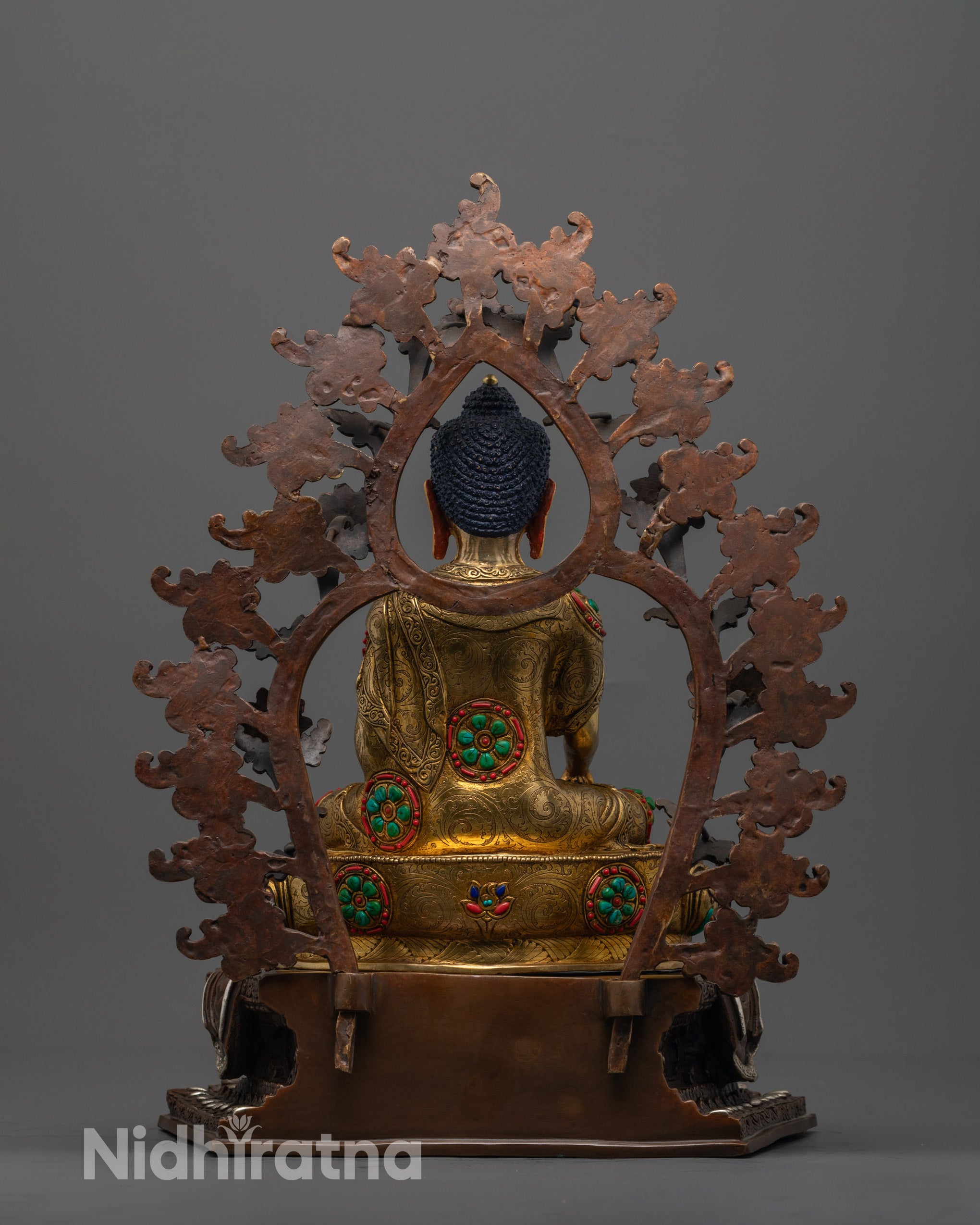 Rear view of copper Shakyamuni Buddha Statue highlighting the hollow chamber