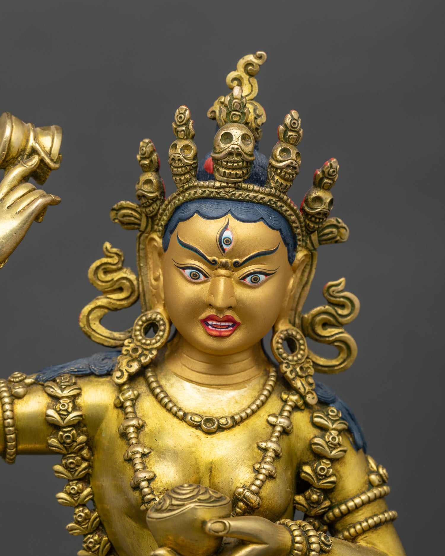 Regular close-up of Achi Chokyi Drolma figurine showing lotus pedestal and posture
