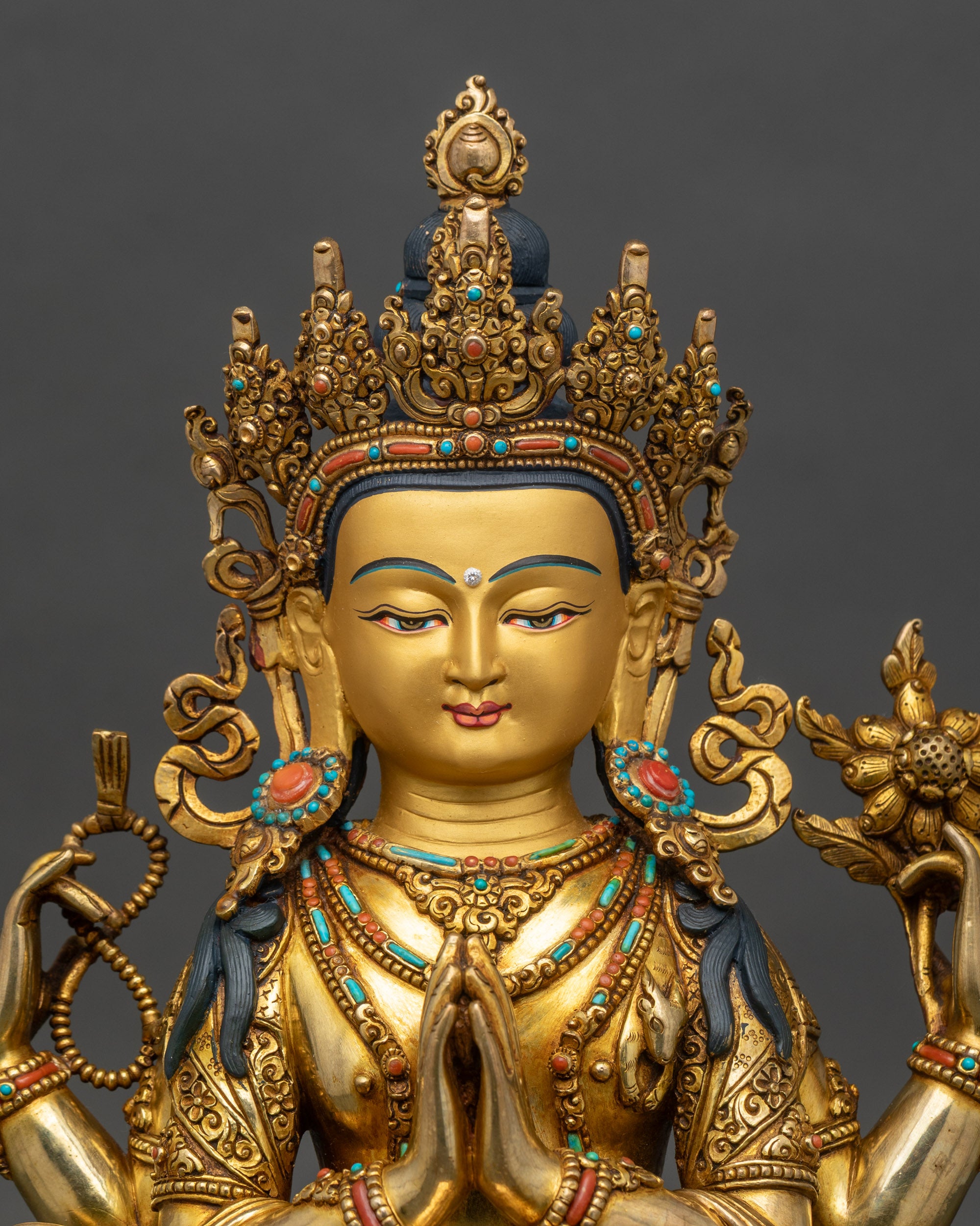 Regular close-up of Avalokiteshvara statue showing intricate copper and gemstone details