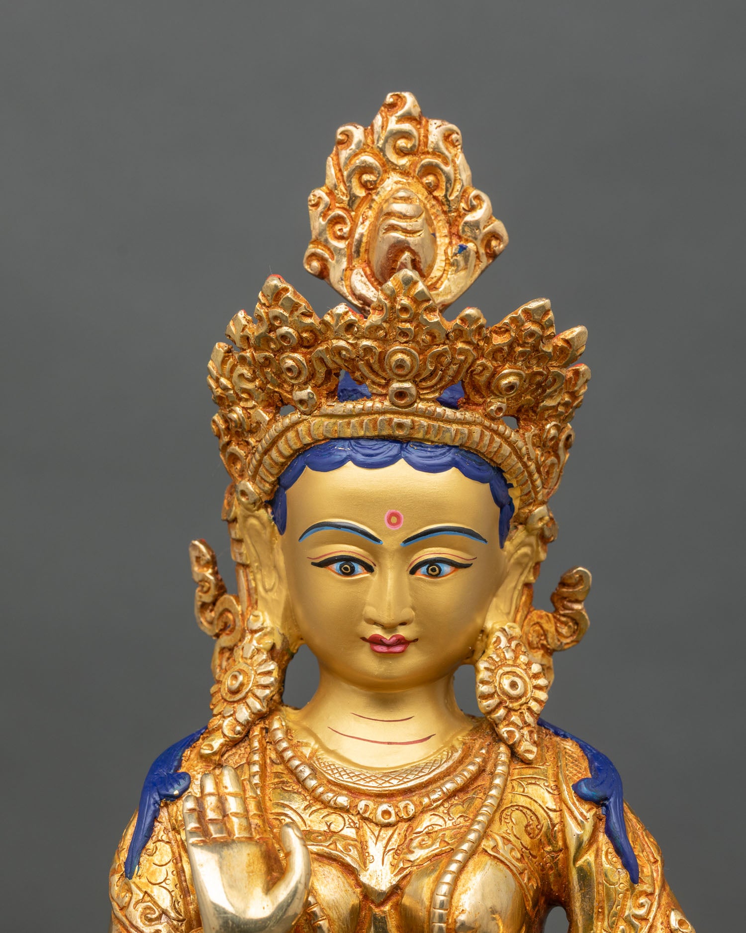 Regular close-up of Yeshe Tsogyal, detailed Newar craftsmanship, gold-gilded copper
