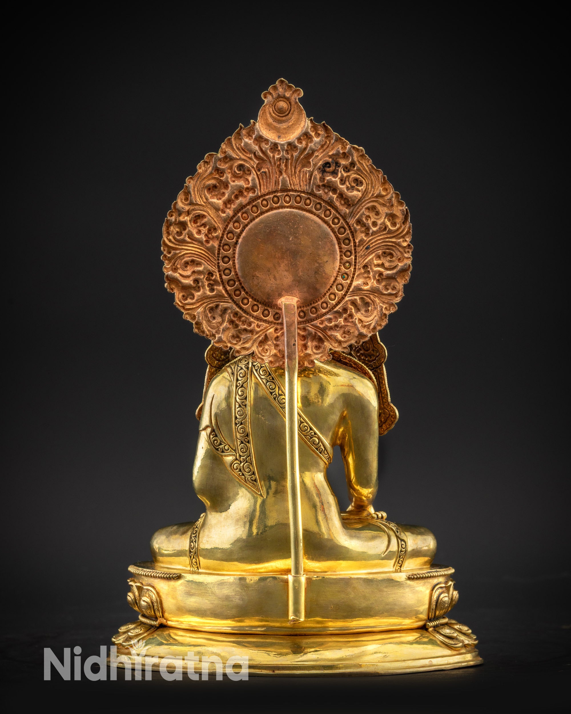 Regular back view of sacred Jowo Rinpoche Buddha statue with radiant halo