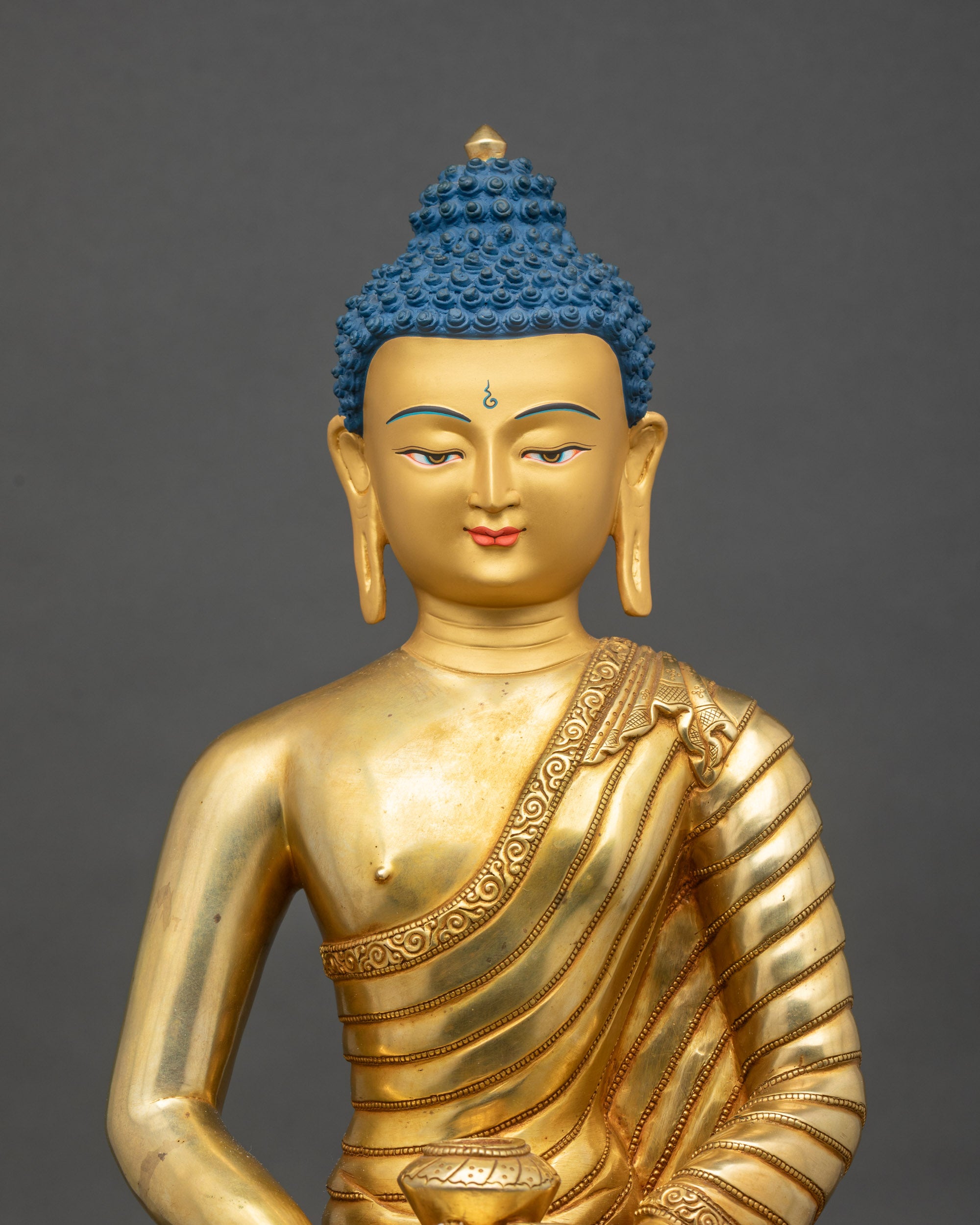 Regular close-up of Amitabha Buddha, polished gold layers and floral monastic garments