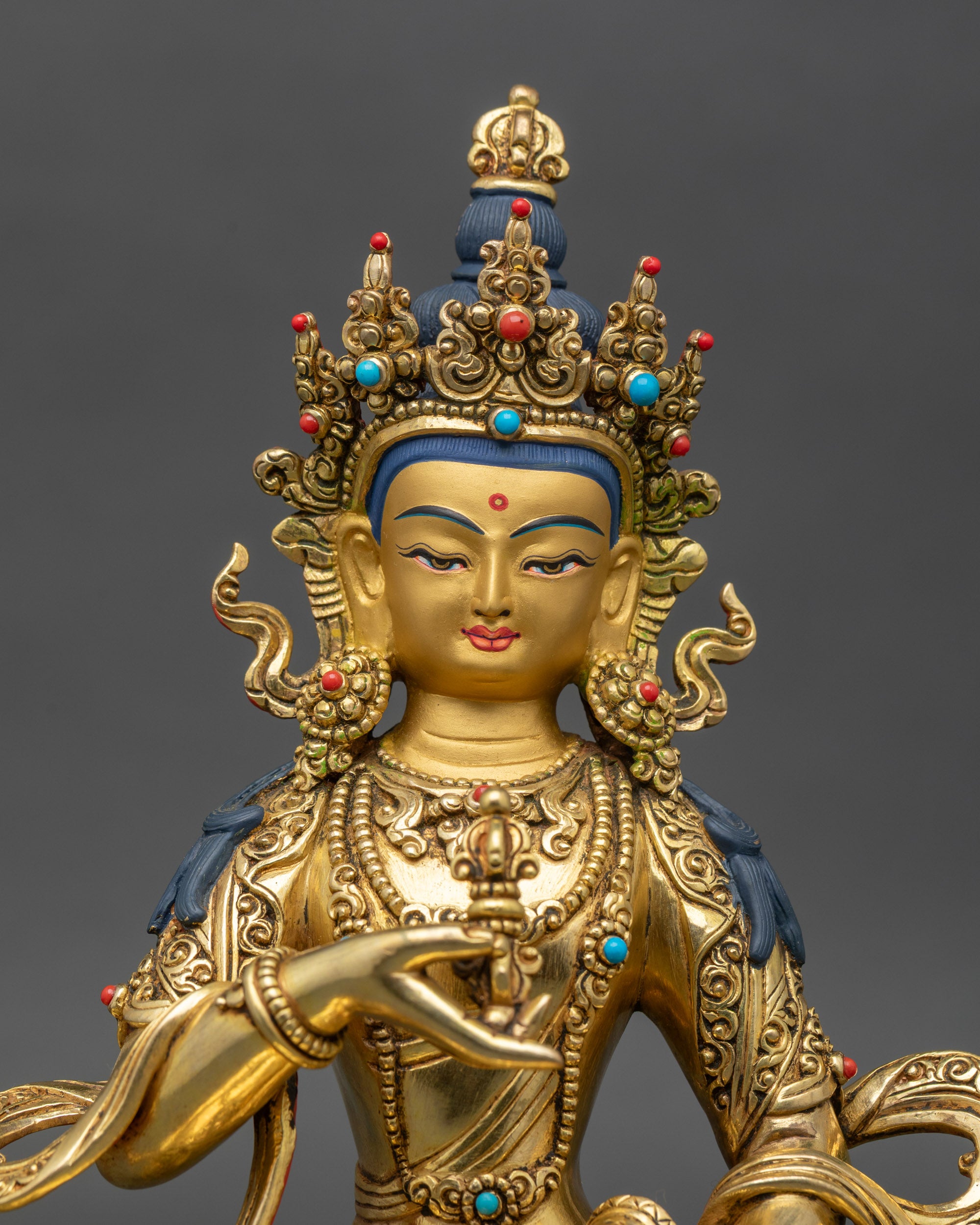 Regular close-up of Vajrasattva Bodhisattva showing copper and gold details