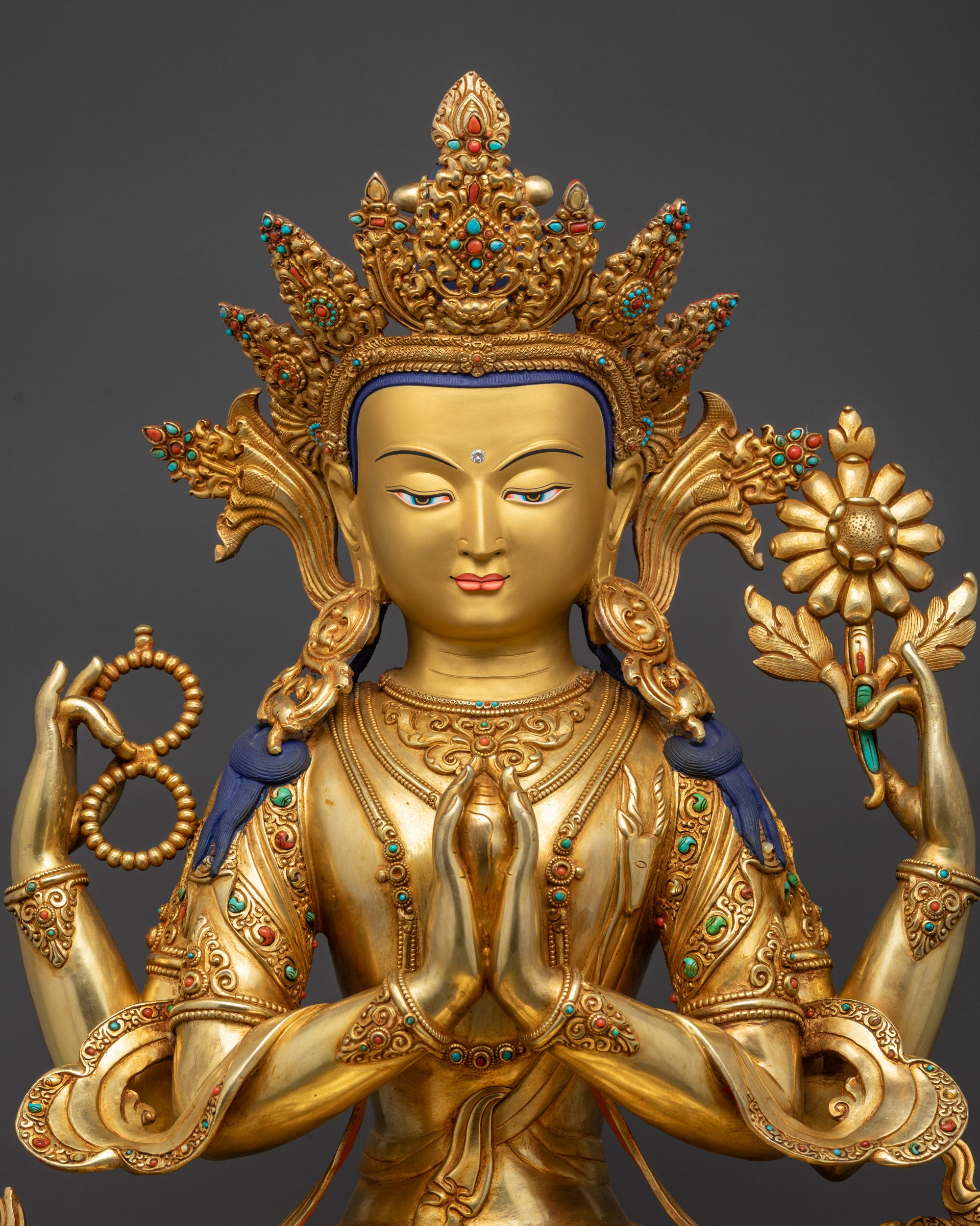Regular close up Chenrezig Buddha sculpture with five-jeweled crown and flowing robes
