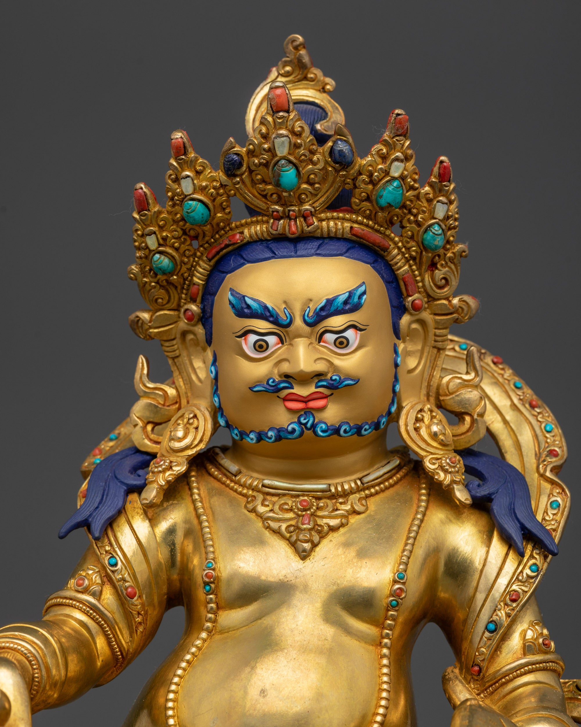 Regular close up Dzambhala holding citrion fruits and jewels with detailed lotus seat and ornate decorations