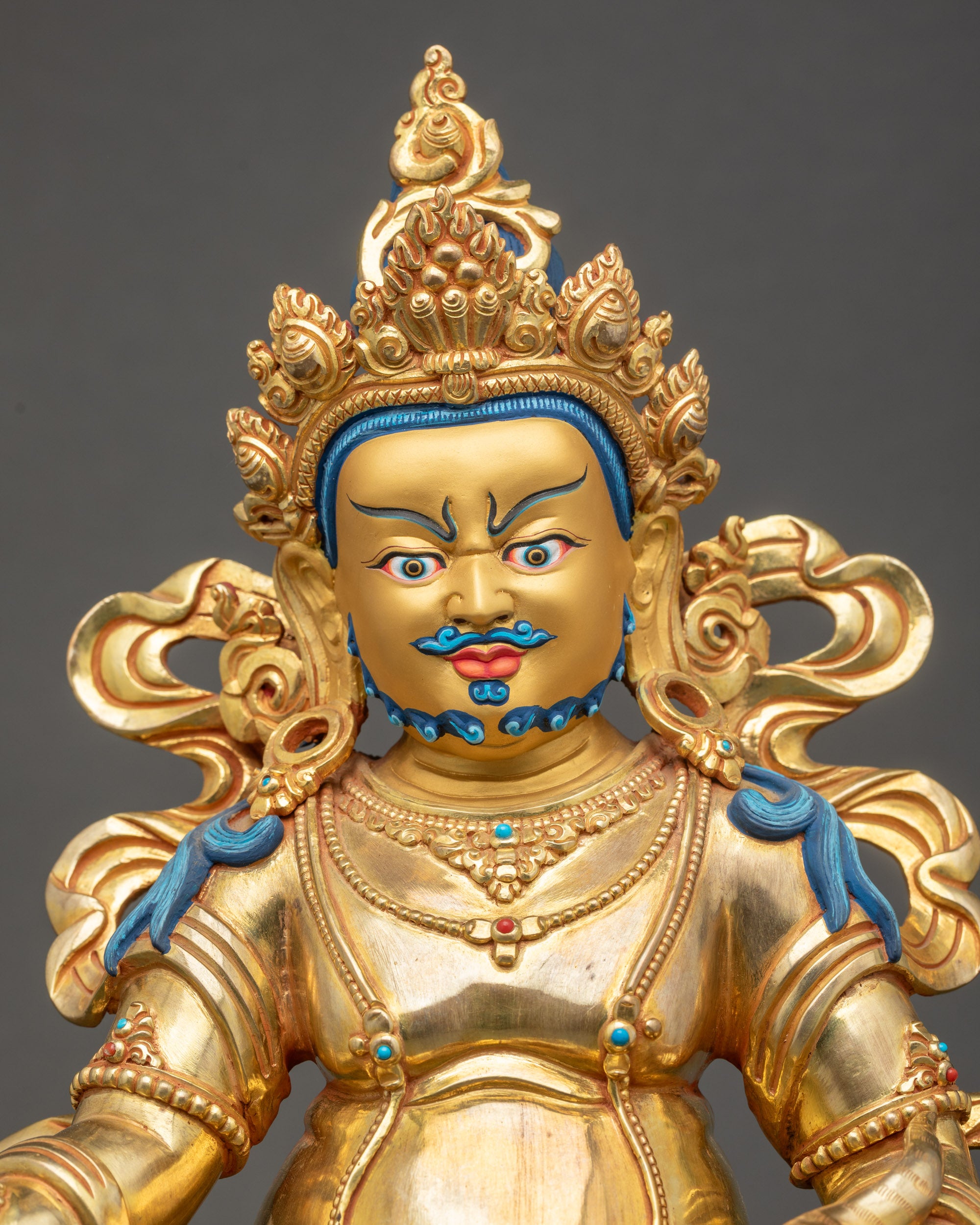 Regular close up Dzambhala statue showing five-jeweled crown and jewelry details