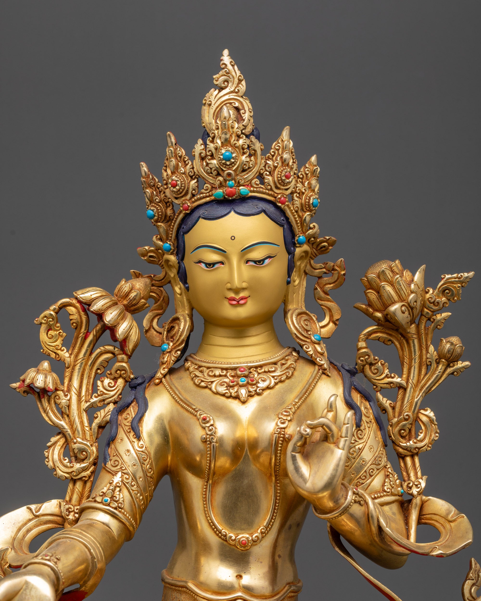 Regular close up Green Tara Statue with flowing robes and Utpala flower in left hand
