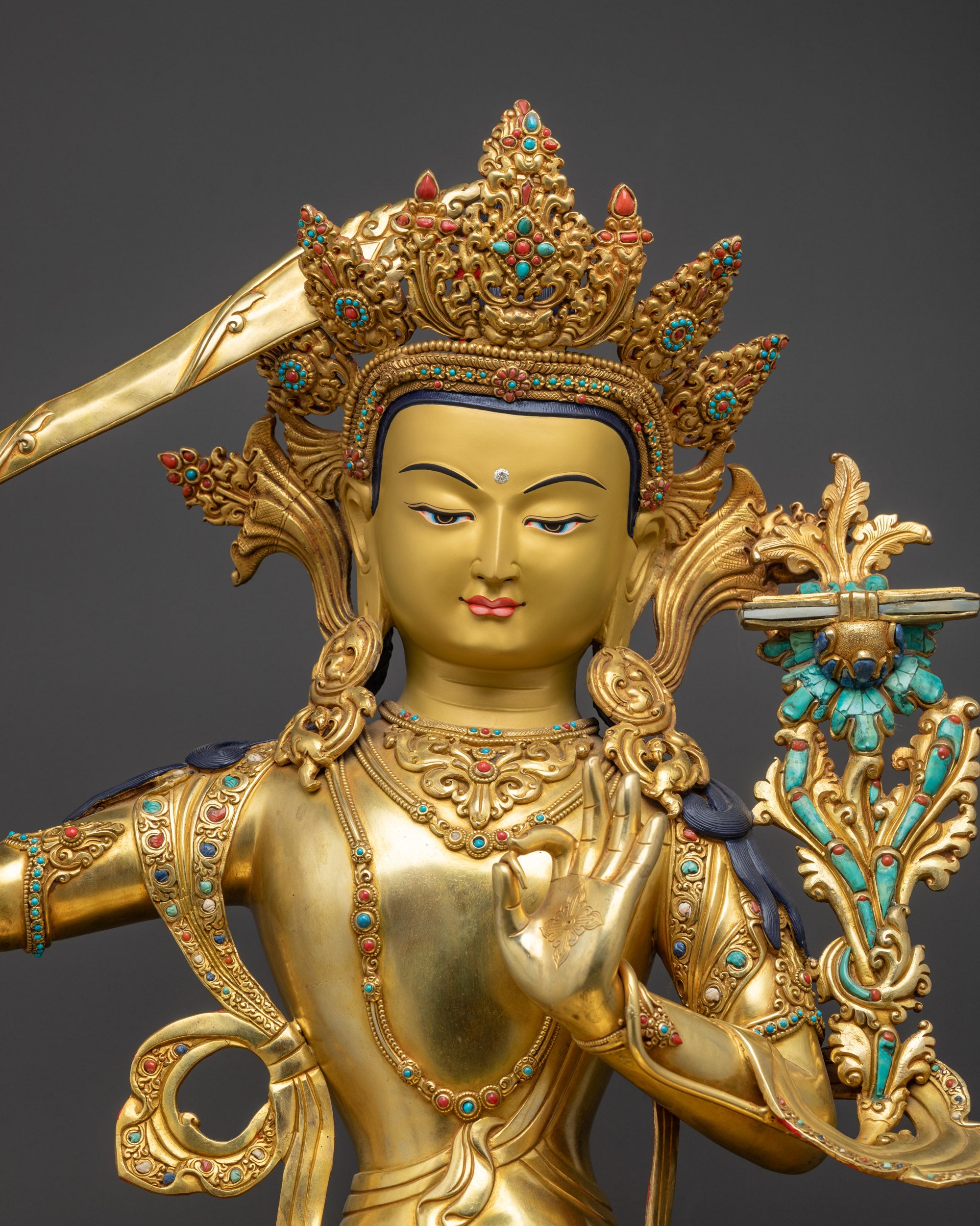 Regular close up Manjushri Sculpture showing serene meditative posture and robes