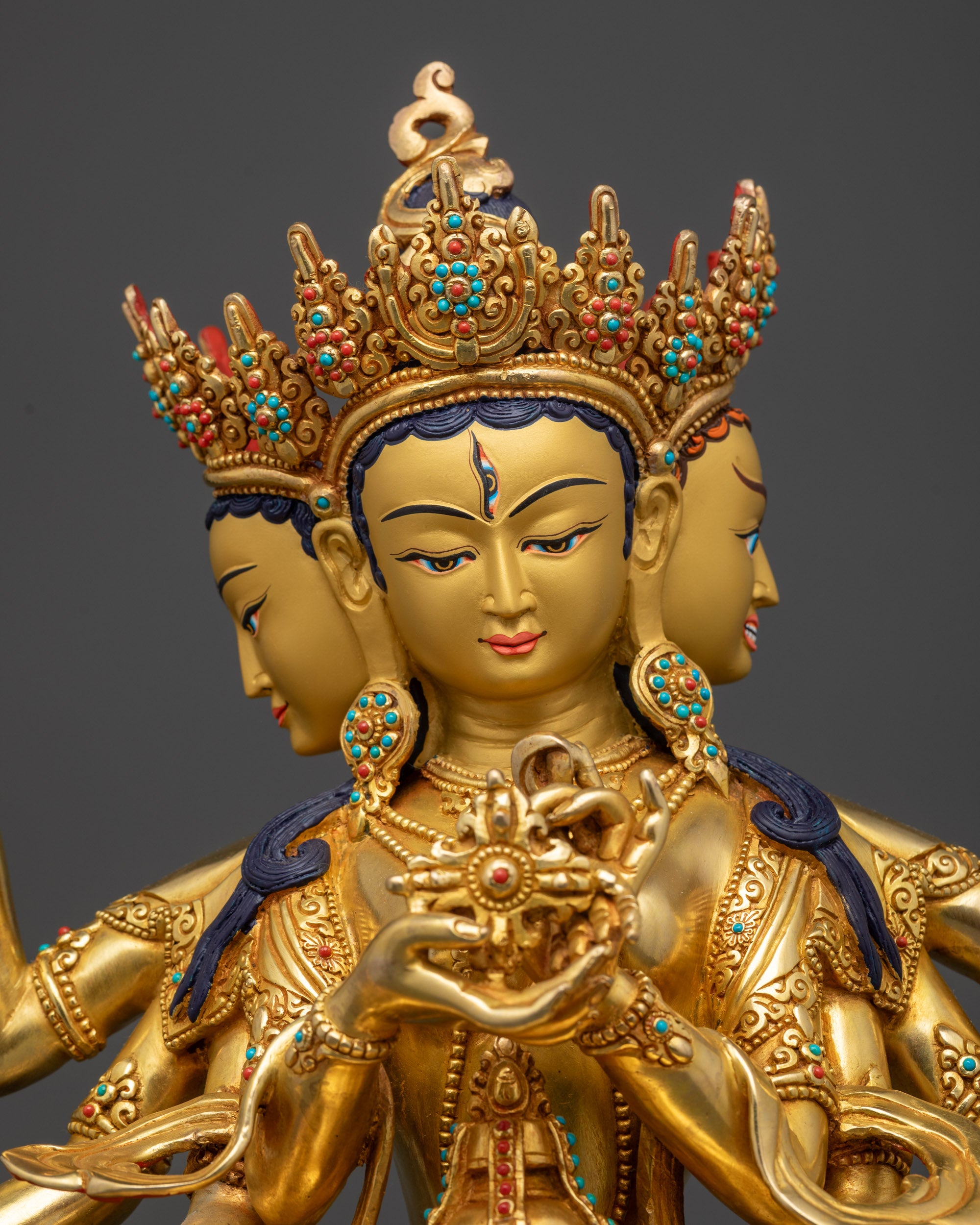 Regular close up Namgyalma holding sacred objects adorned with semi-precious stones