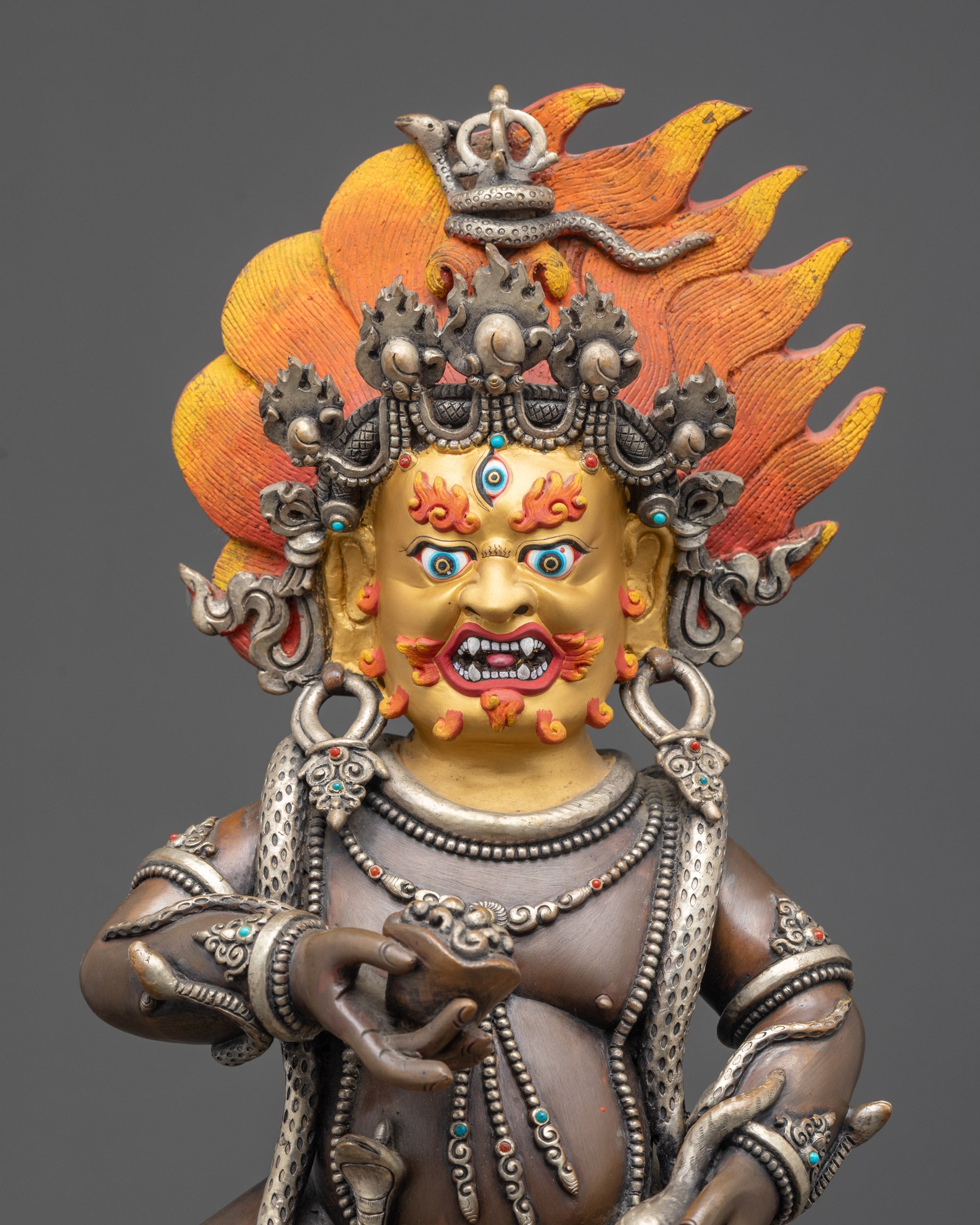 Regular close up Oxidized Black Dzambhala statue showing tiger skin and serpent details