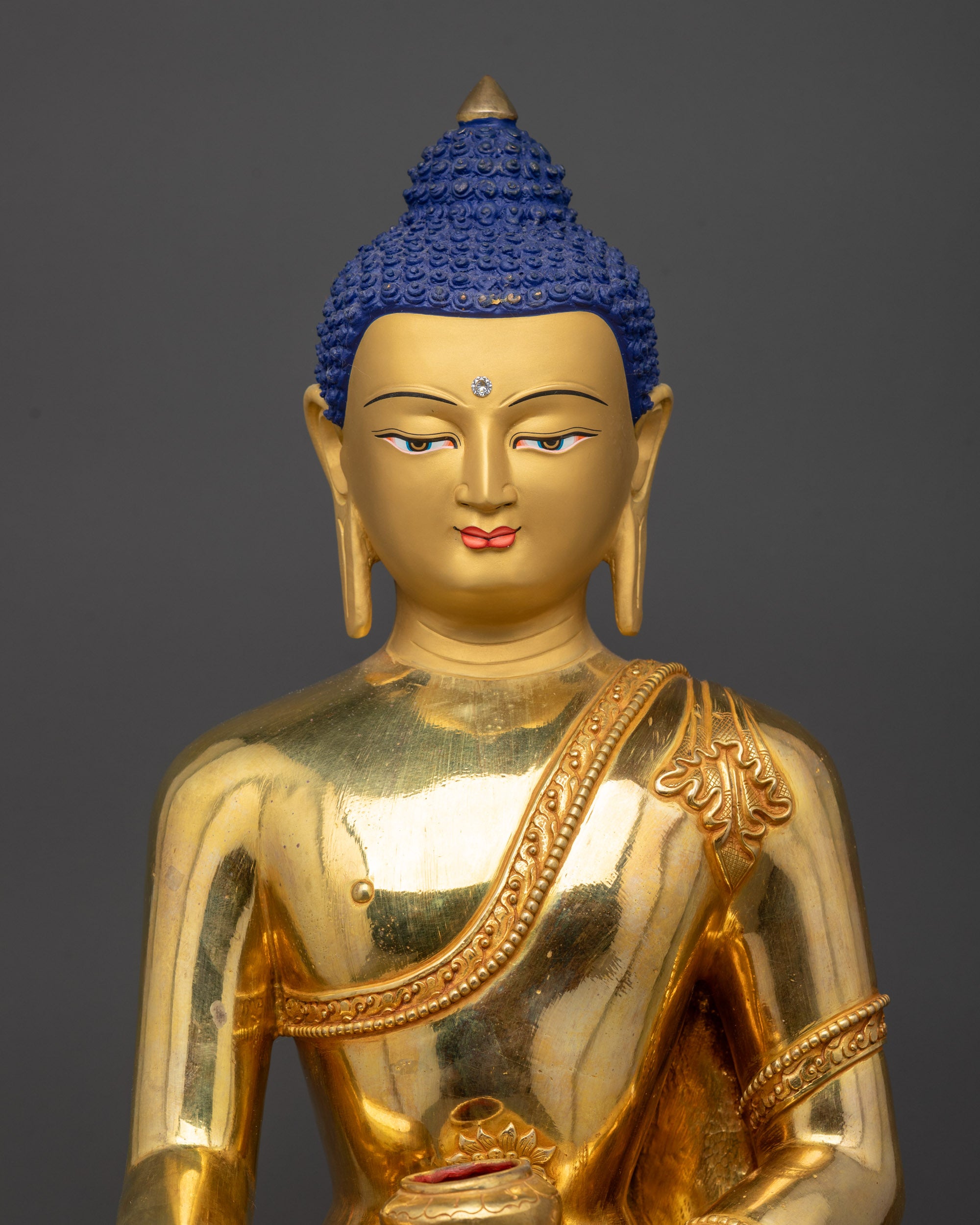 Regular close up Shakyamuni Buddha Statue highlighting intricate monk robe patterns