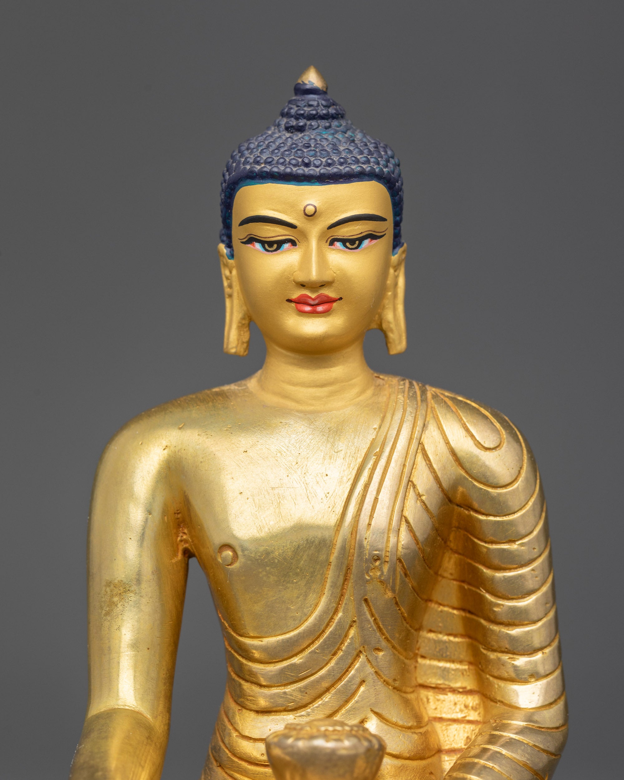 Regular close up Shakyamuni Buddha statue holding begging bowl Nepalese handicraft