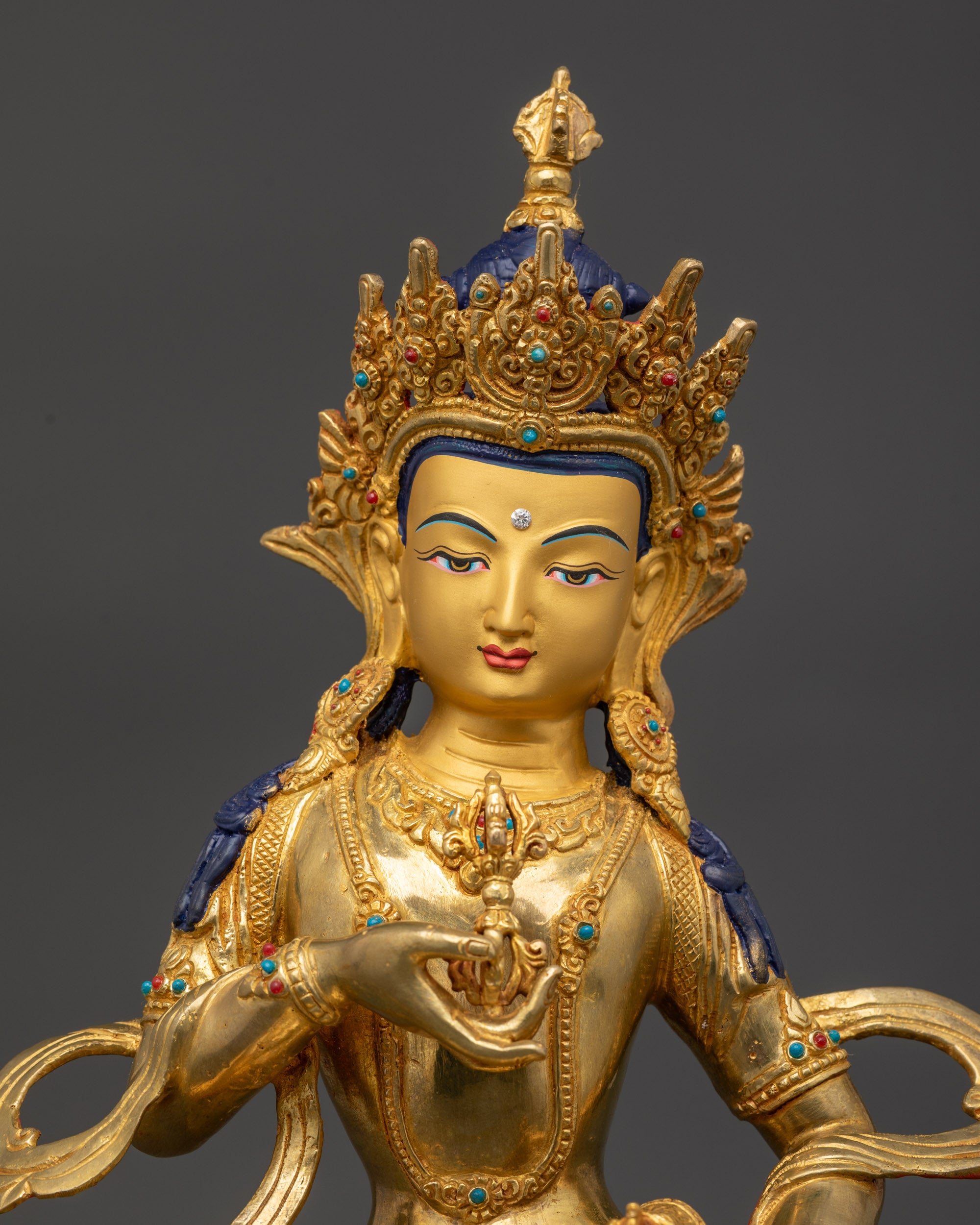 Regular close up Vajrasattva statue showing intricate robes and semi-precious stones