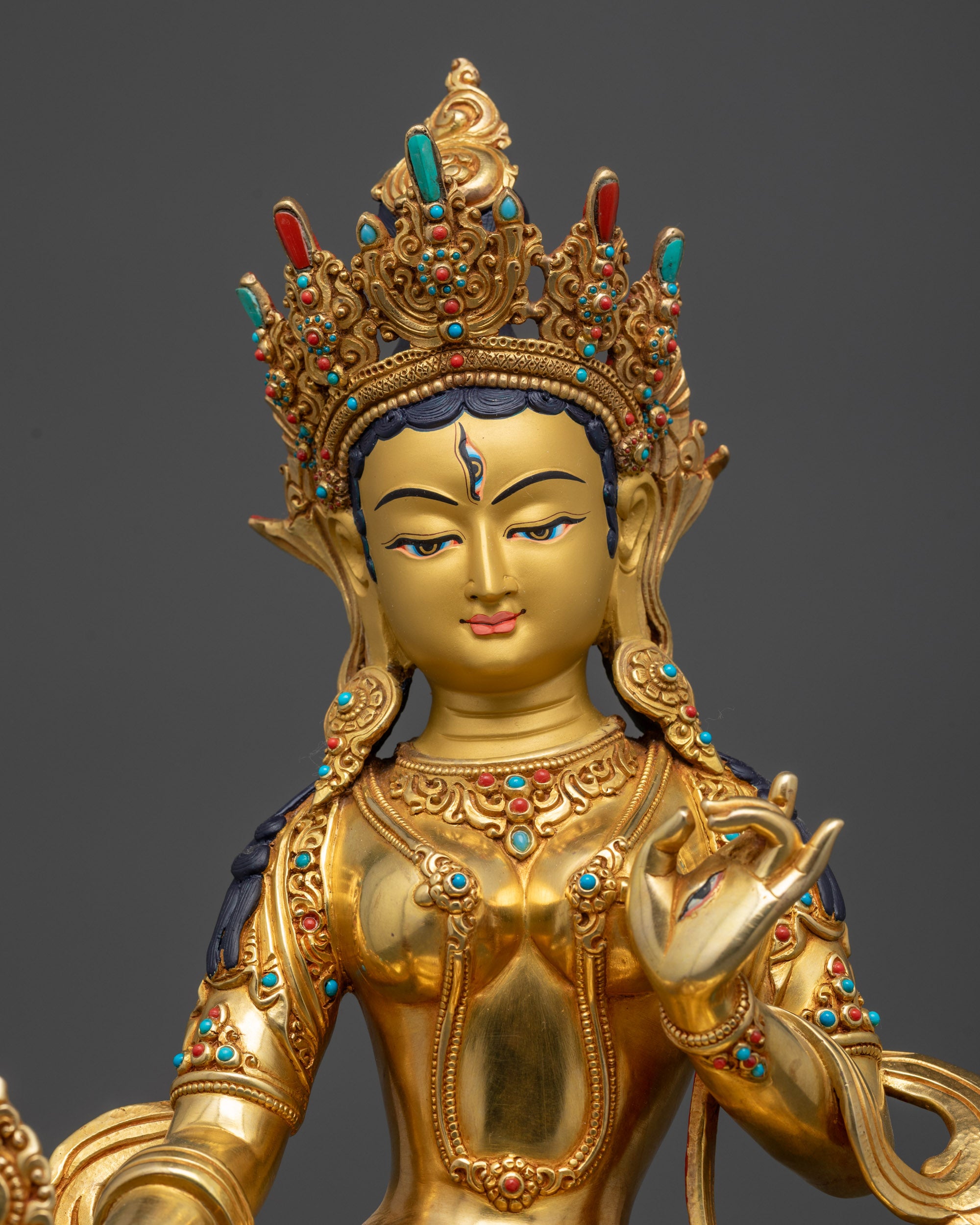 Regular close up White Umbrella Dukar Statue showing parasol and wisdom wheel