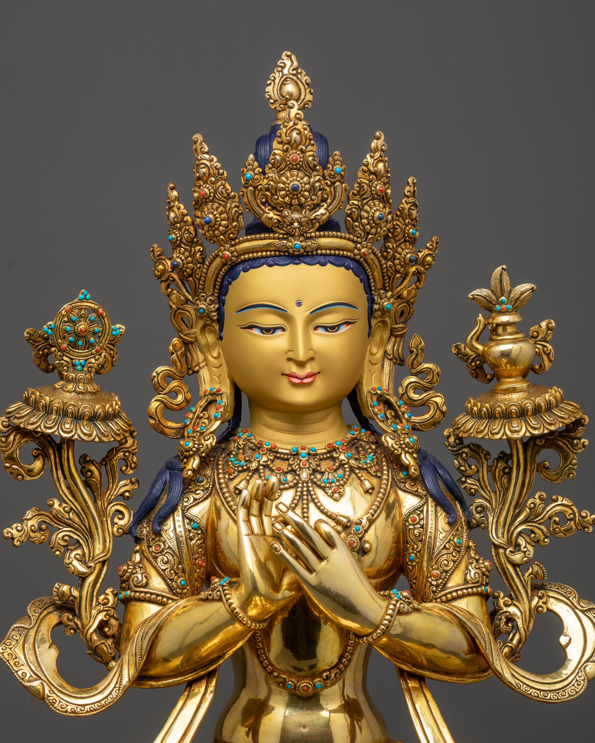 Regular close up of Maitreya Buddha showcasing detailed crown and earrings