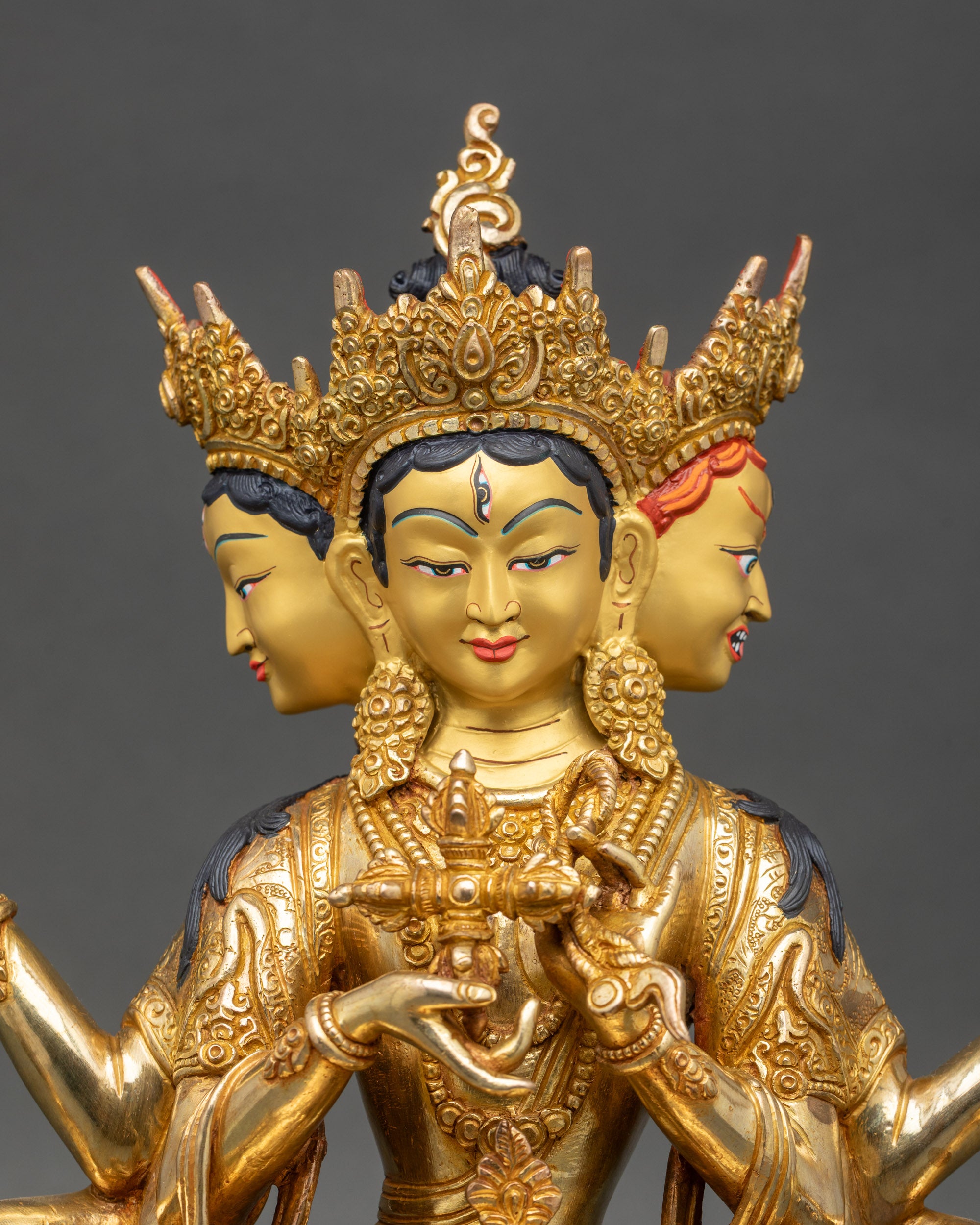 Regular close up of Namgyalma statue with crown, jewelry, and ritual implements