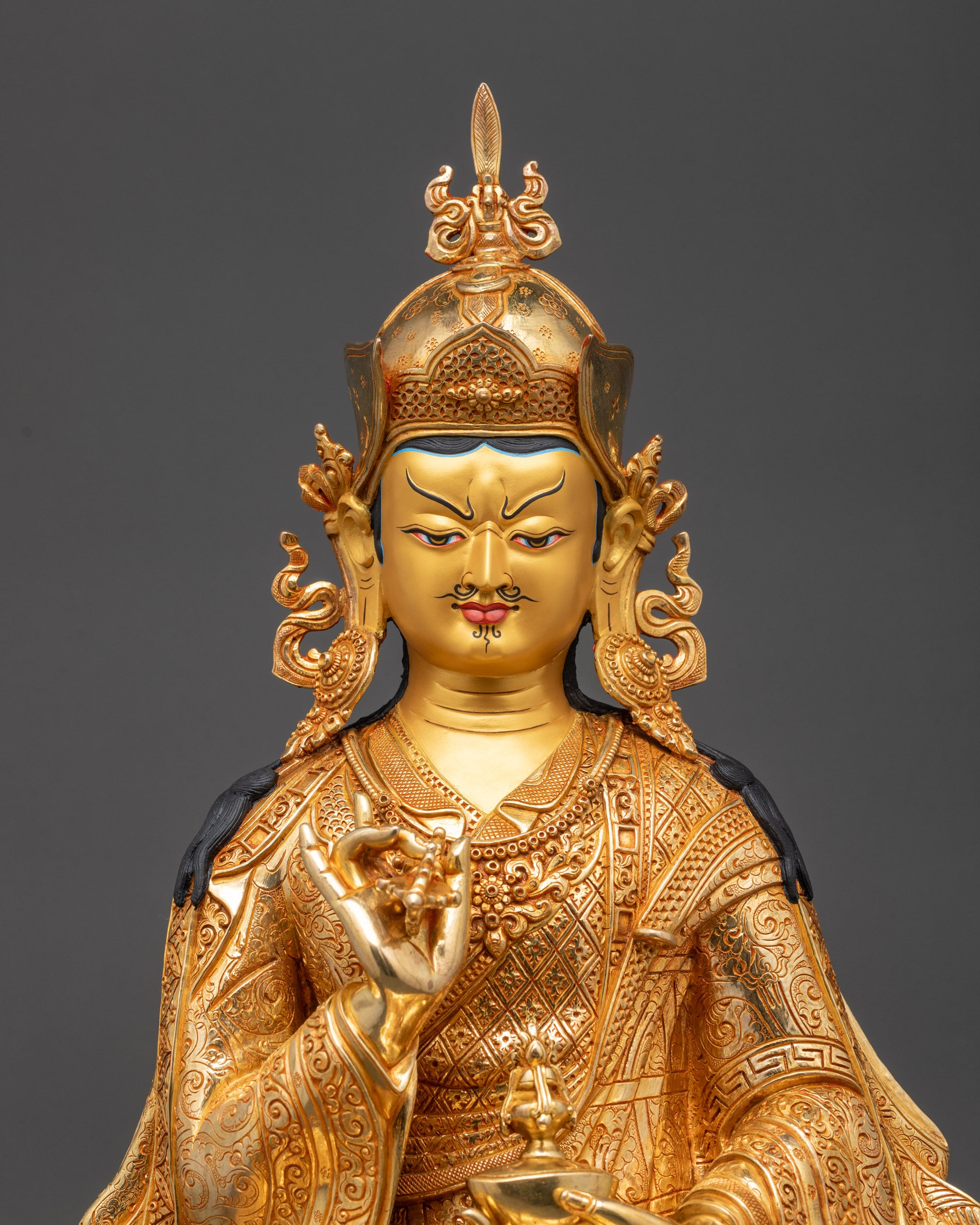 Regular close up of Tsokye Dorje face with gold-gilded features