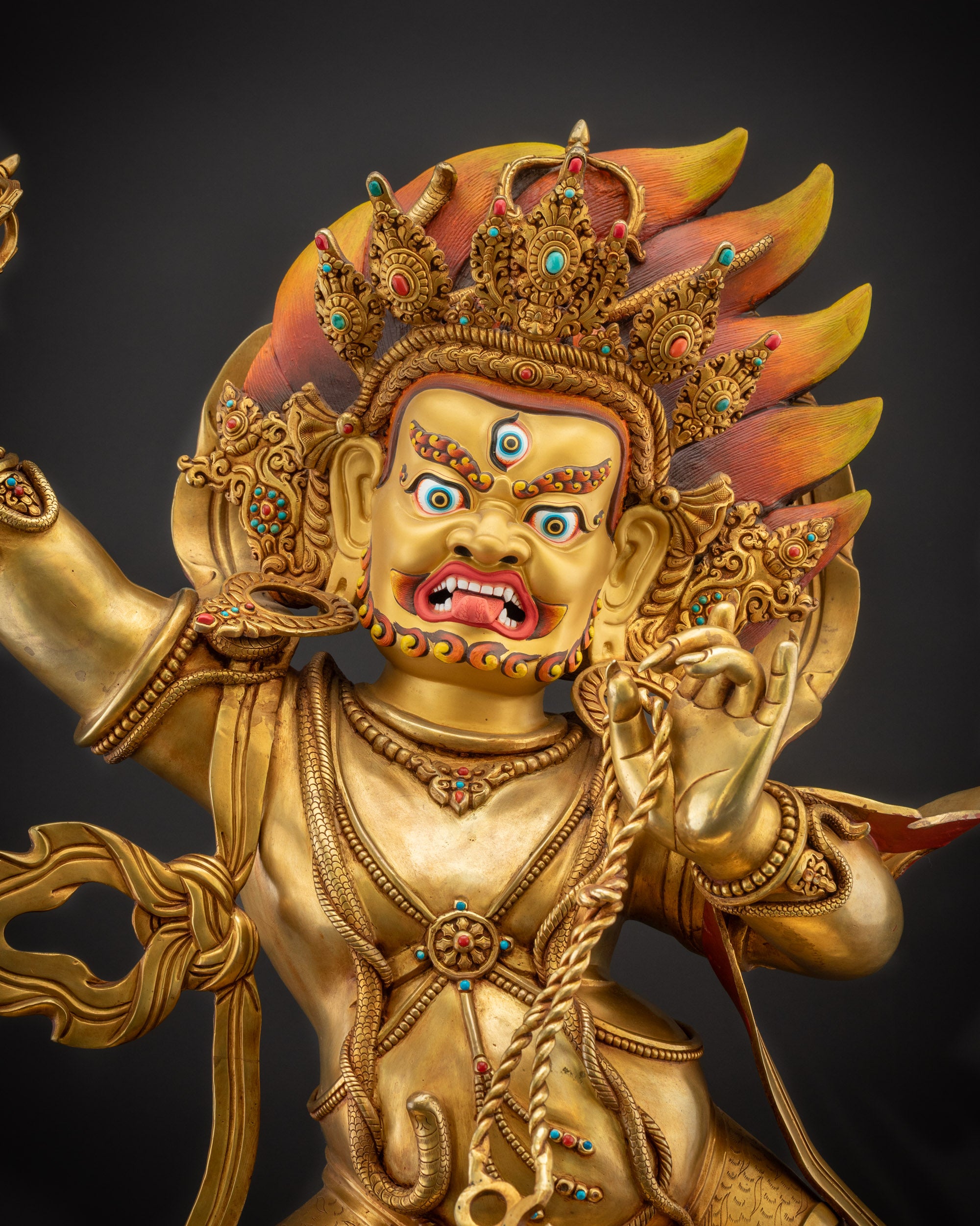 Regular close up of Vajrapani Statue face with red eyebrows and mustache