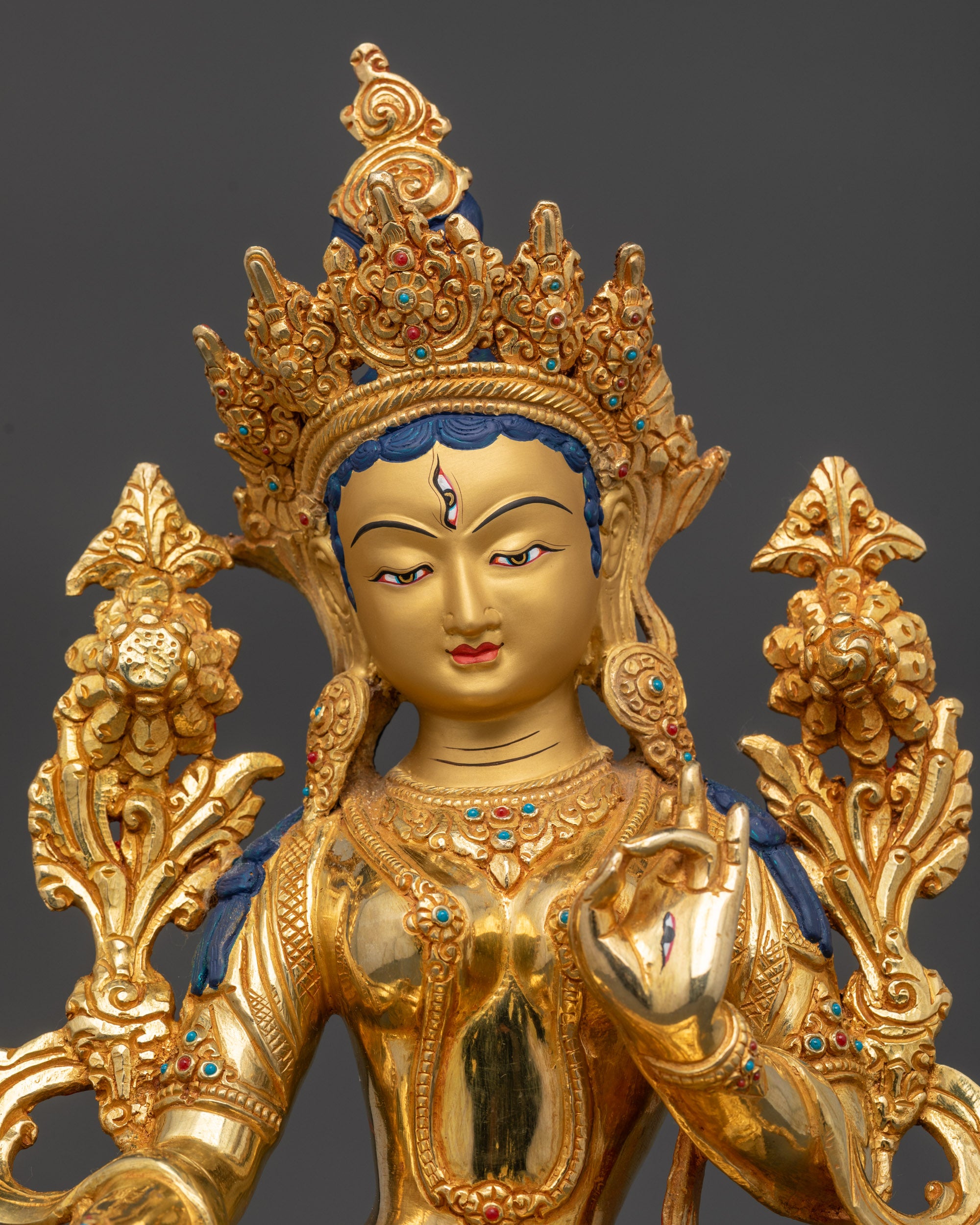 Regular close up of White Tara holding Varada and Vitarka mudra, spiritual blessings