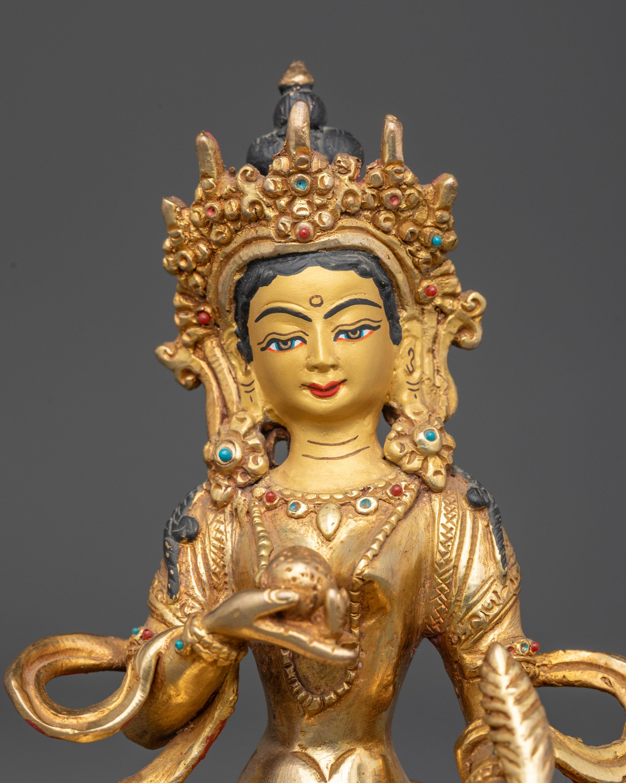 Regular close up of hand-carved Kshitigarbha Bodhisattva copper statue with crown