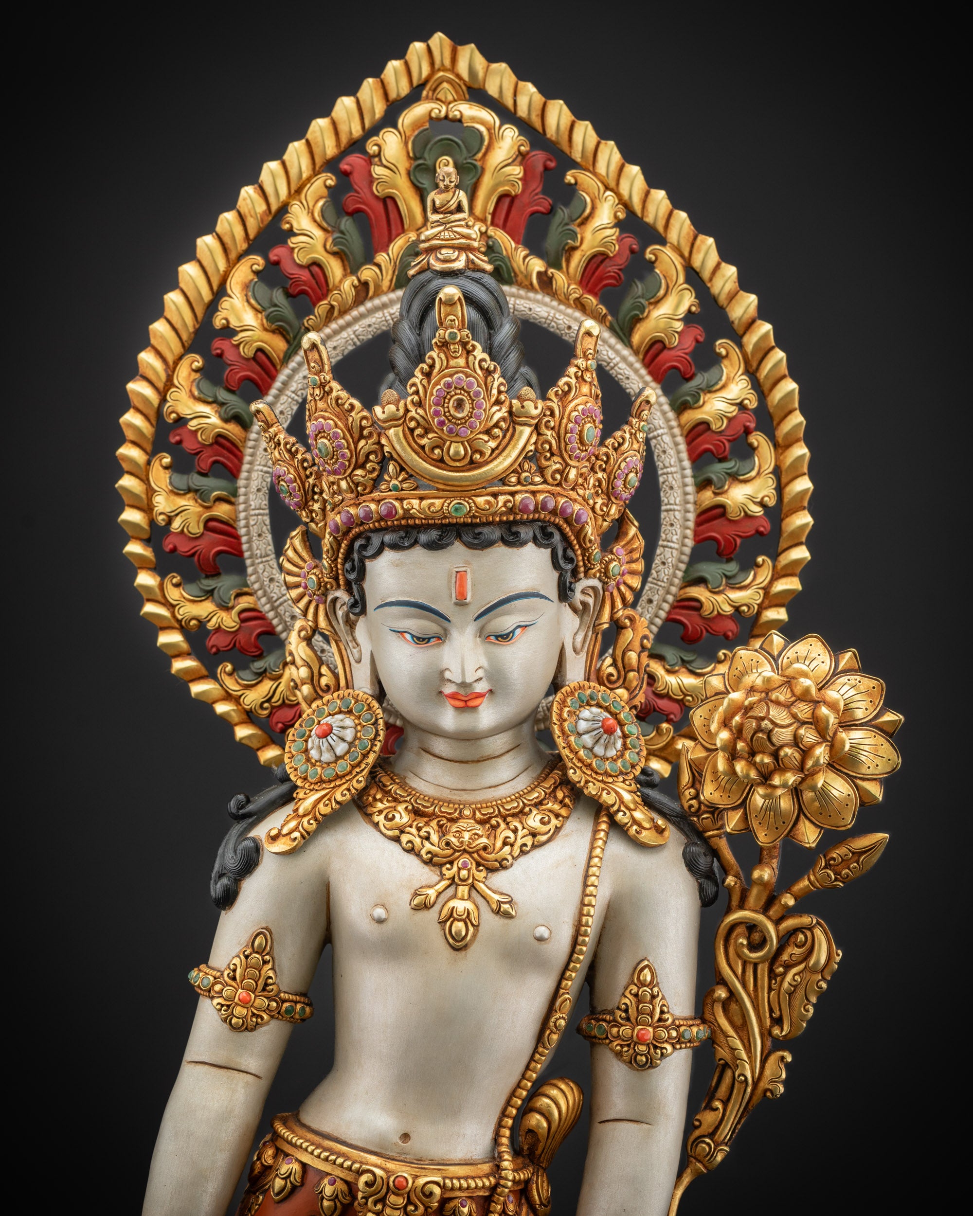 Regular close up of standing Lokeshvara with five-jewelled crown and floral halo