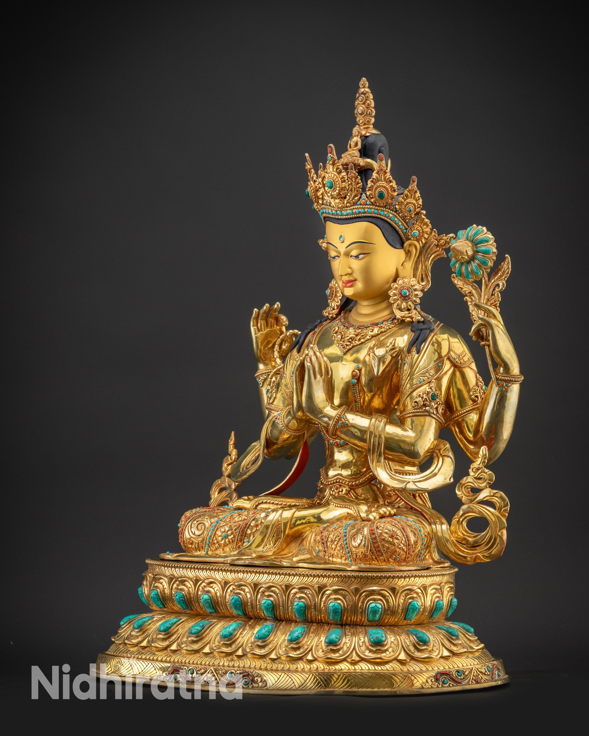 Regular left side view of Chenrezig Statue highlighting four arms and held symbolic items