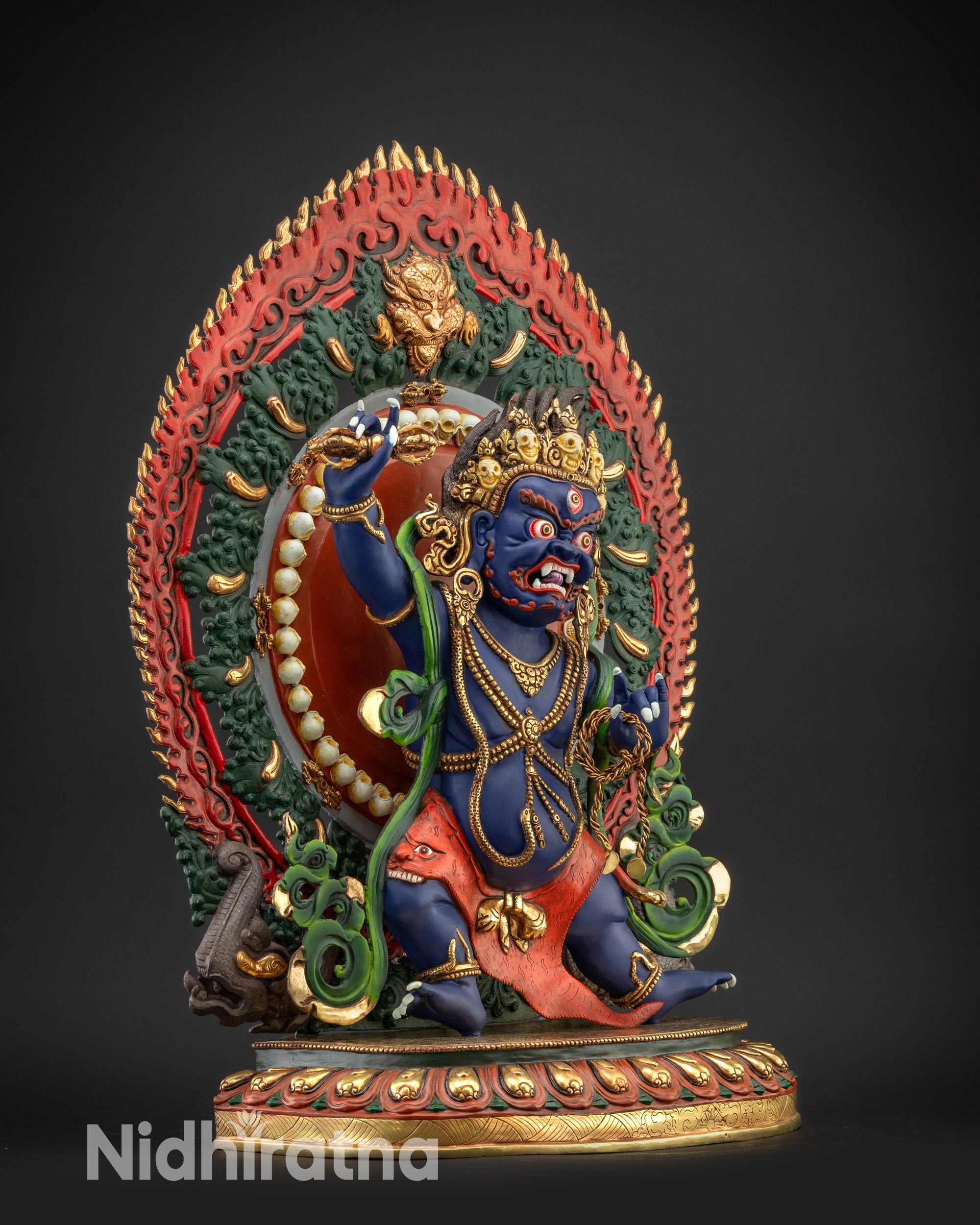 Regular left side view of Vajrapani statue with halo flames and flowing scarf