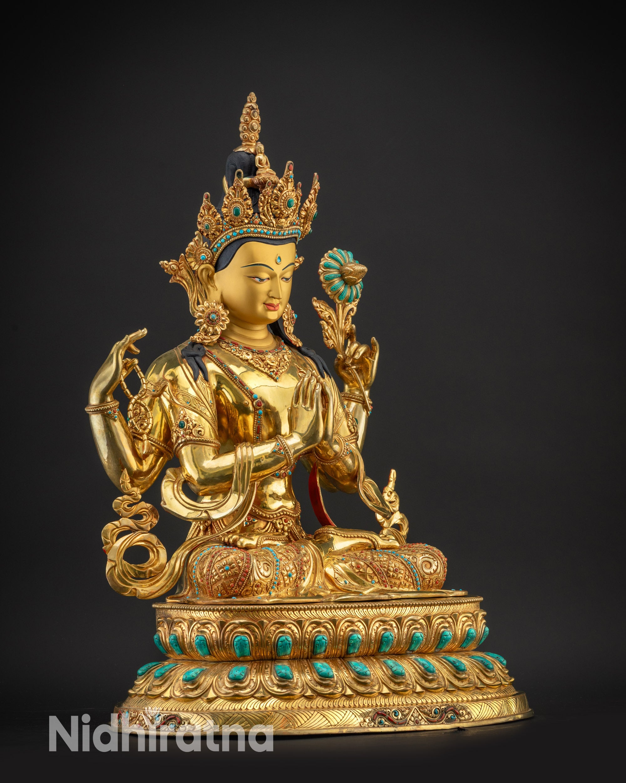 Regular right side view of Chenrezig Statue showing swirling robe and carved lower garments