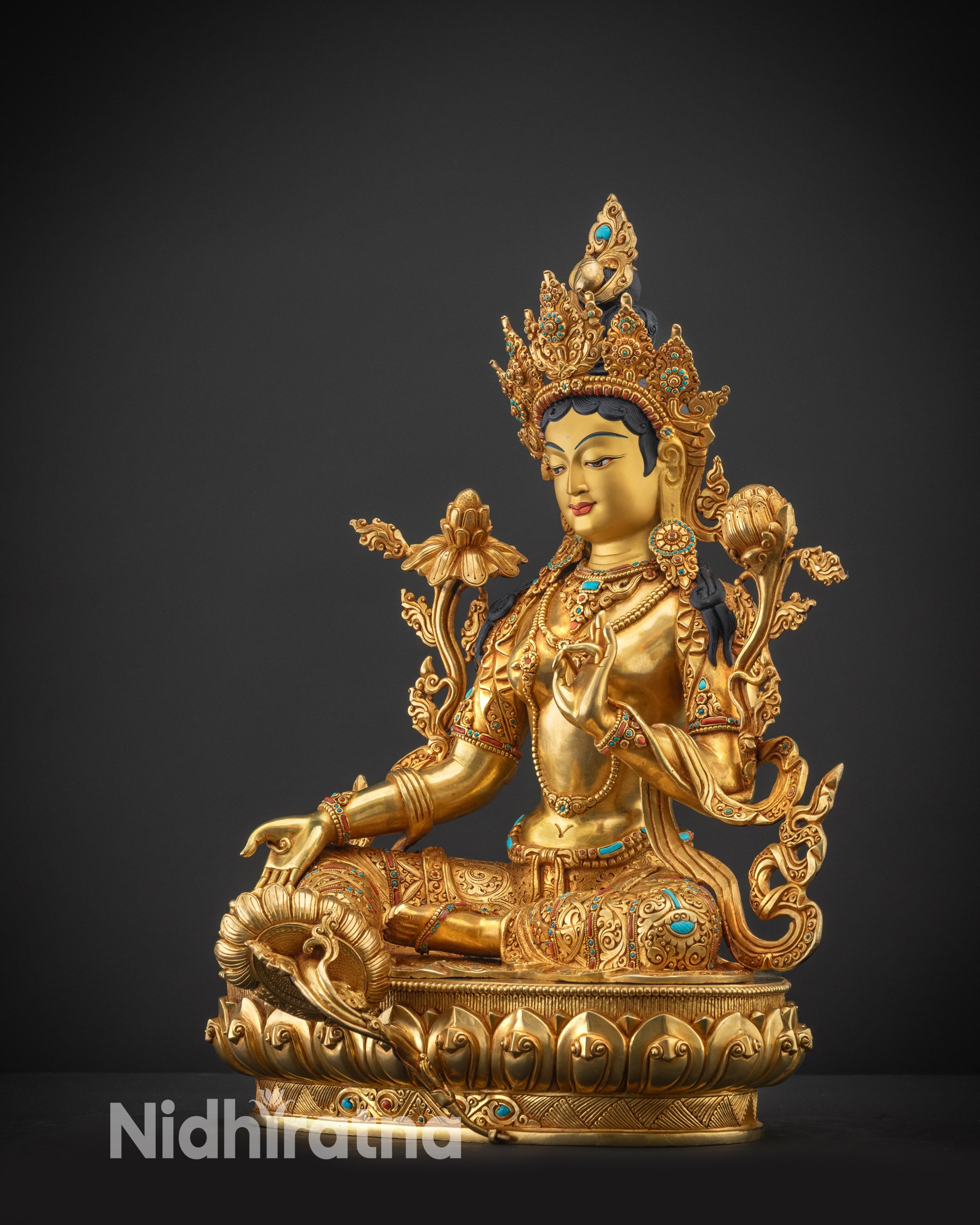 Regular side left view of Green Tara statue highlighting gold fire-gilded body
