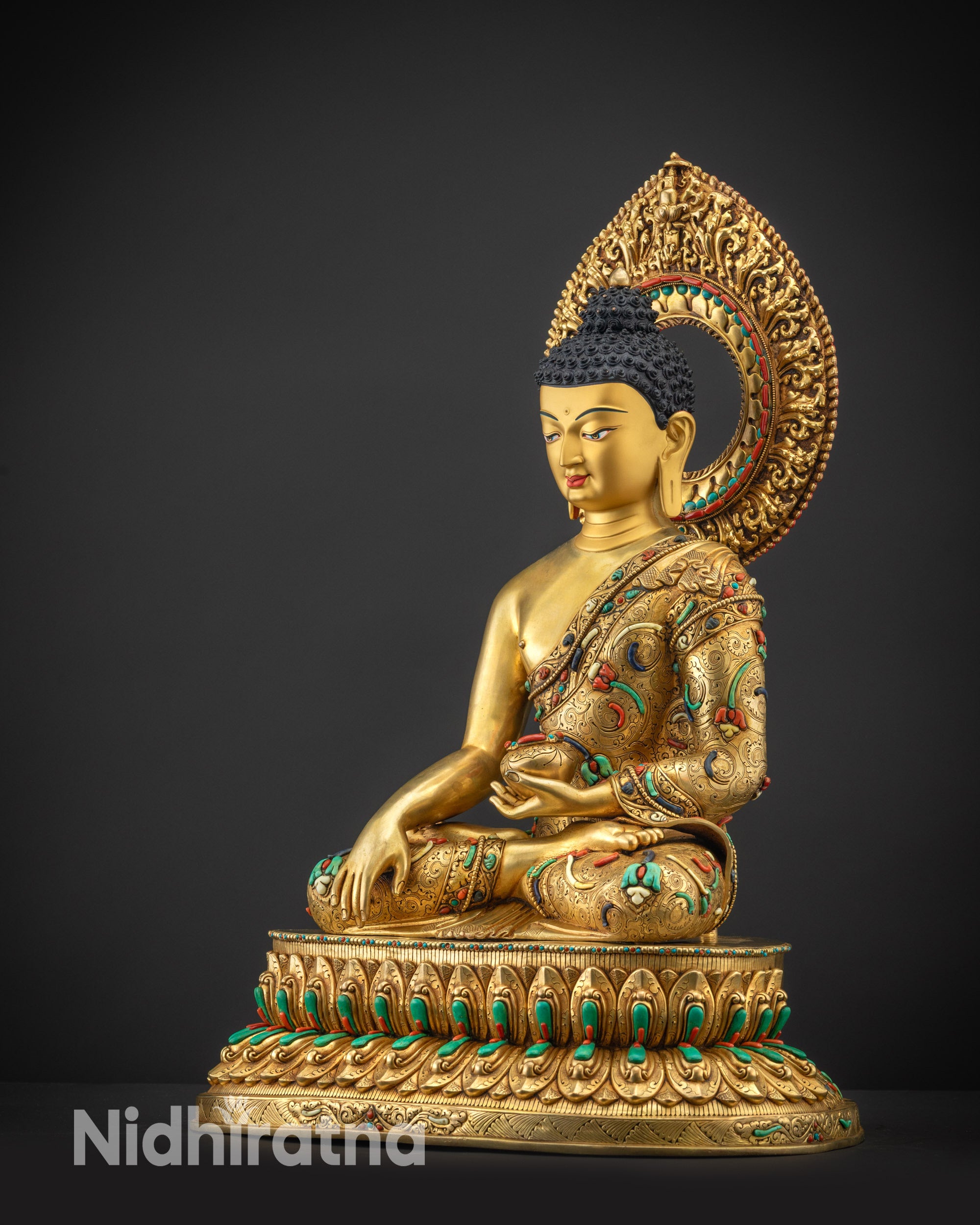 Regular side left view of Shakyamuni Buddha statue showing layered monk’s robe design