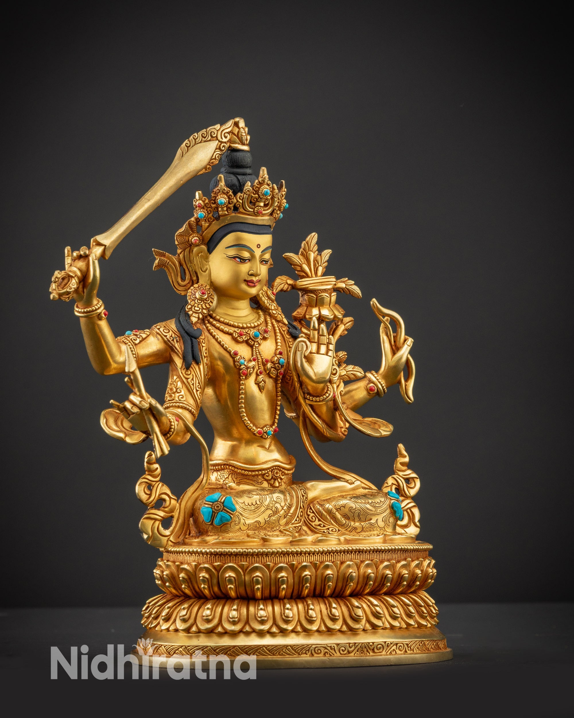 Regular side right view of Maha Manjushri statue showing four arms and fire-gilded details