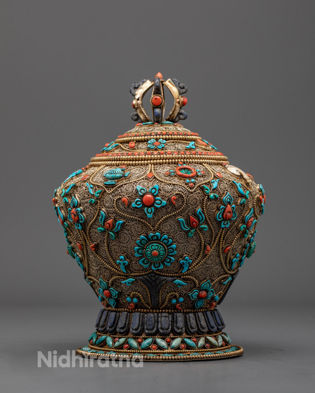 Tibetan copper rice bowl front view with gold plating and gemstones for Buddhist rituals