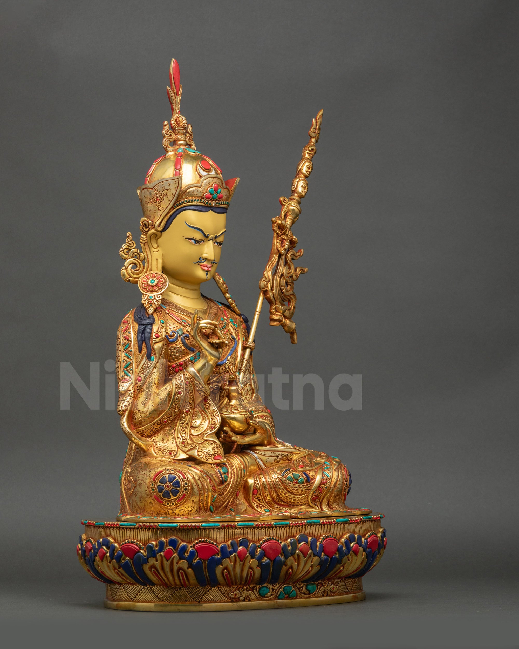 Right-angle view of Tsokye Dorje Statue displaying vajra, kapala, and trident details