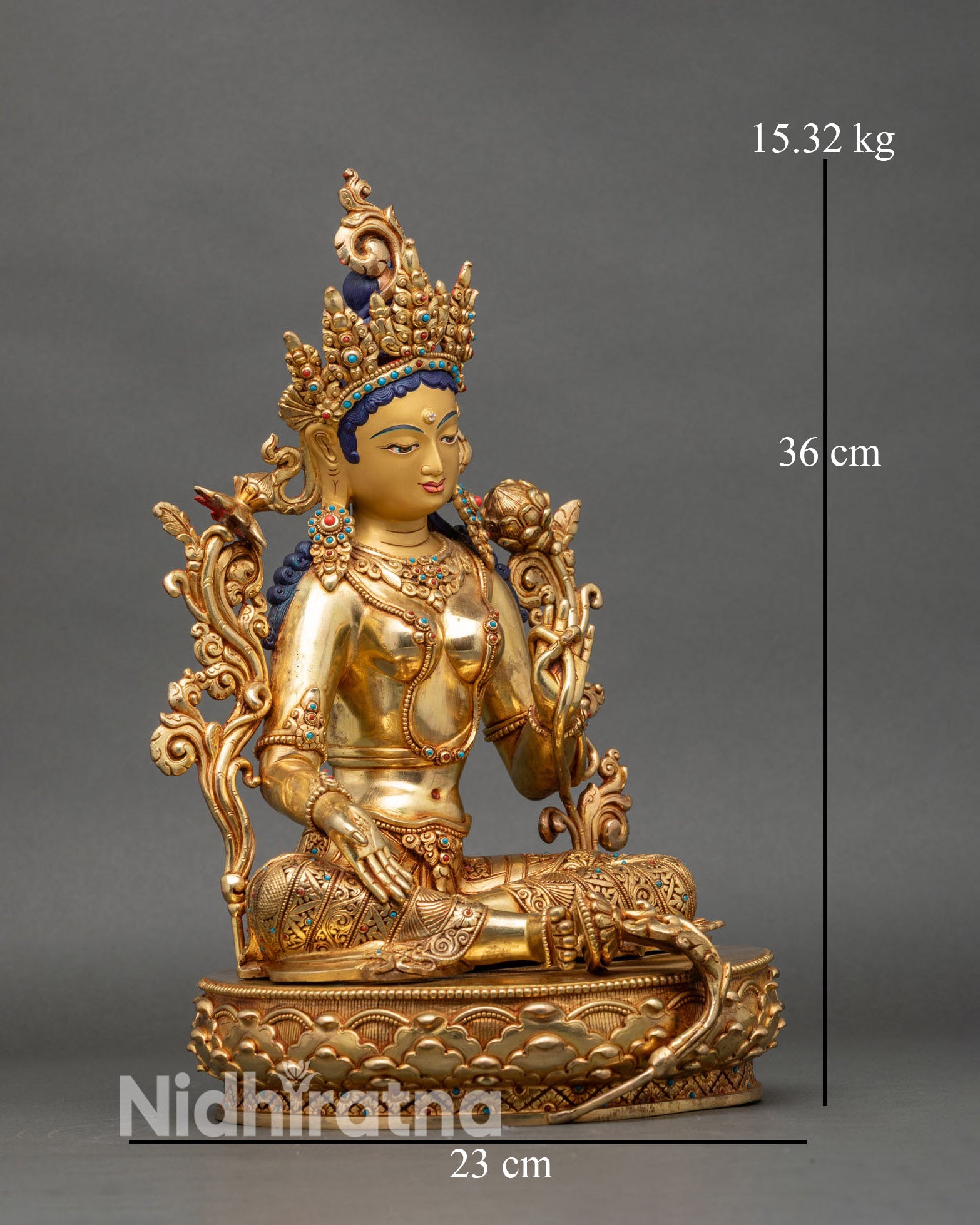 Right profile of Green Tara statue, copper and gold, traditional Nepalese art